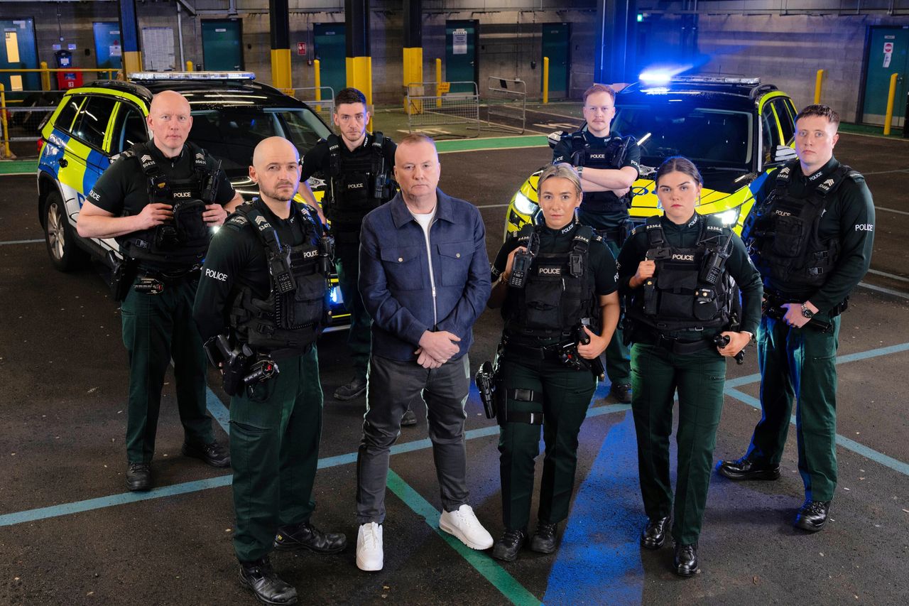 ON MANOEUVRES: Stephen Nolan with the officers who feature in Peelers