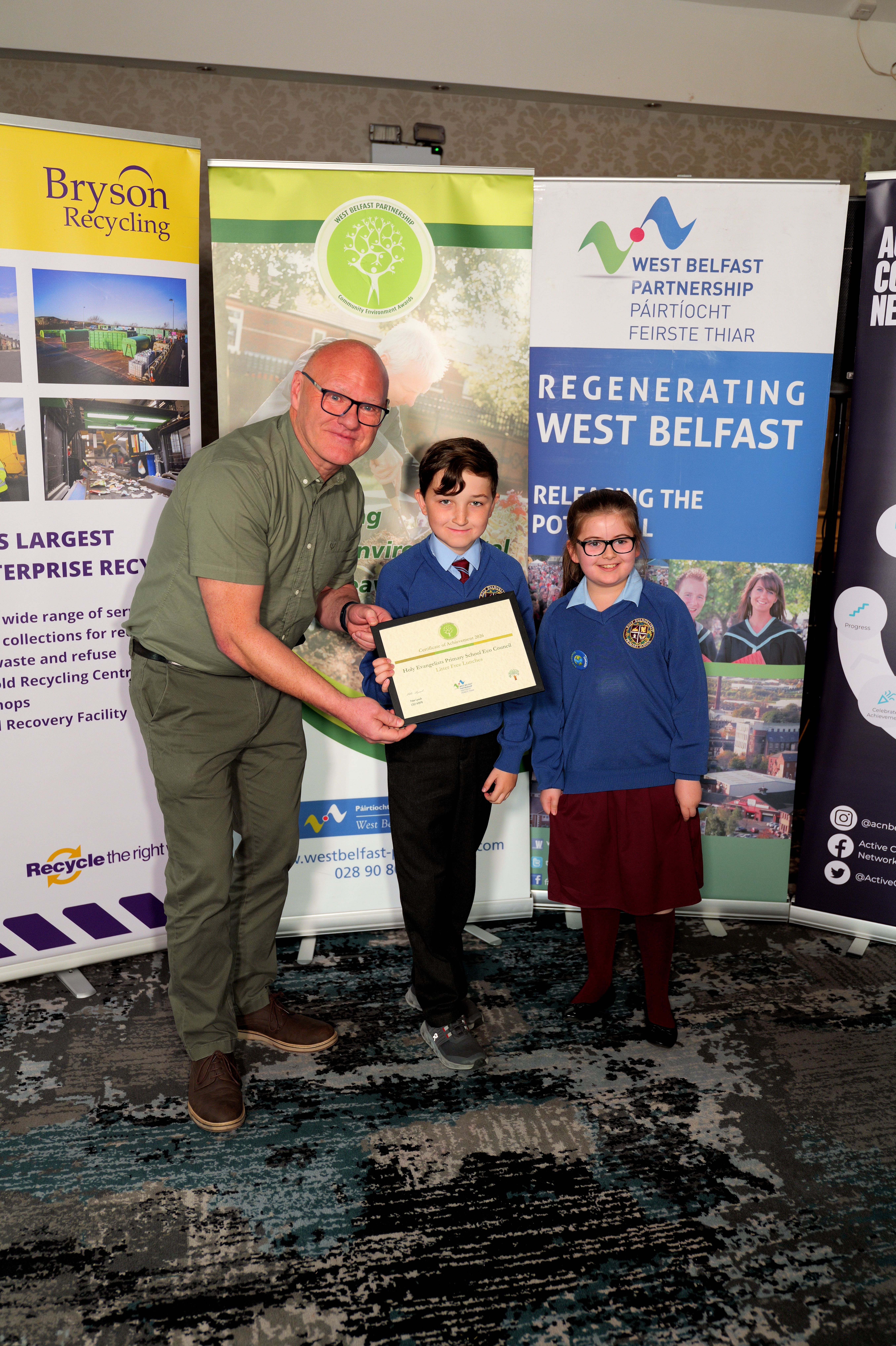 AWARD: Paul Maskey MP with pupils from Holy Evangelist PS, who won an award for their litter-free lunch campaign