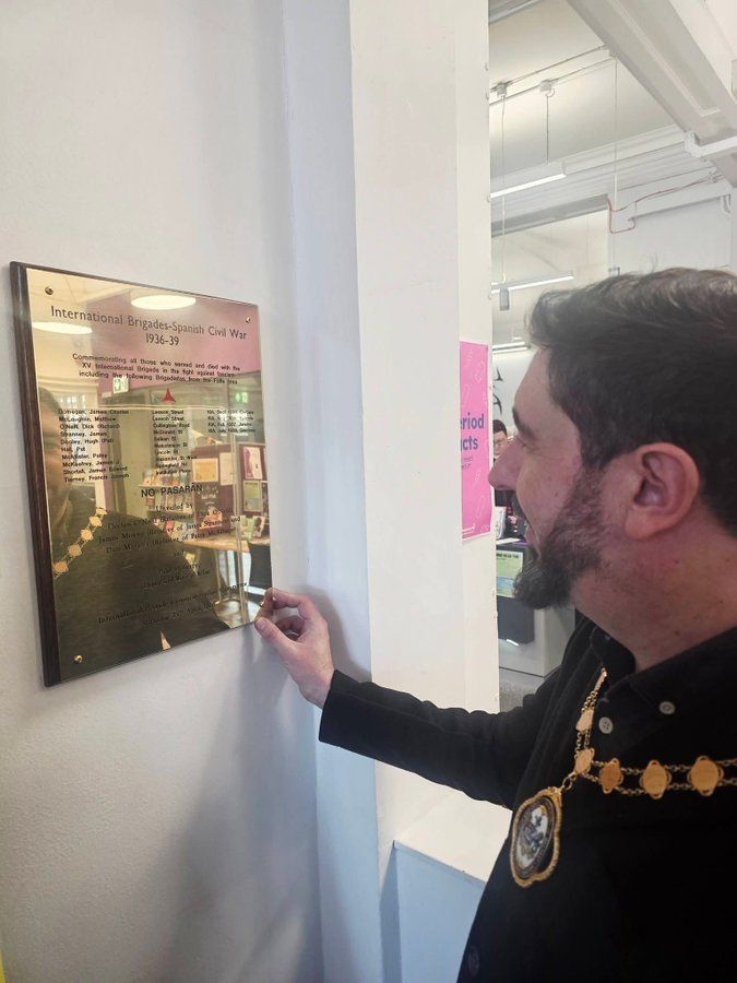 IN MEMORY: Cllr Paul Doherty unveils the Spanish Civil War plague in the Falls Road Library