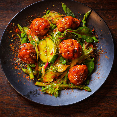 PLATING UP:  Honey chilli soy sweet potato and pork balls with asparagus 