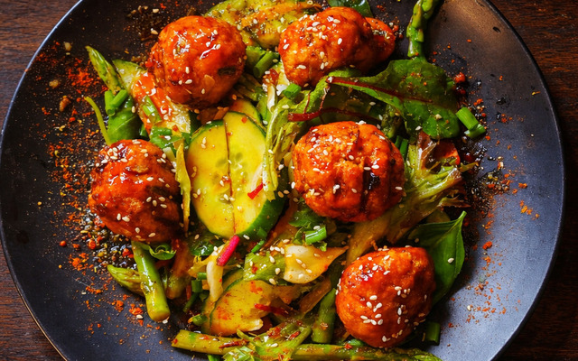 PLATING UP:  Honey chilli soy sweet potato and pork balls with asparagus 