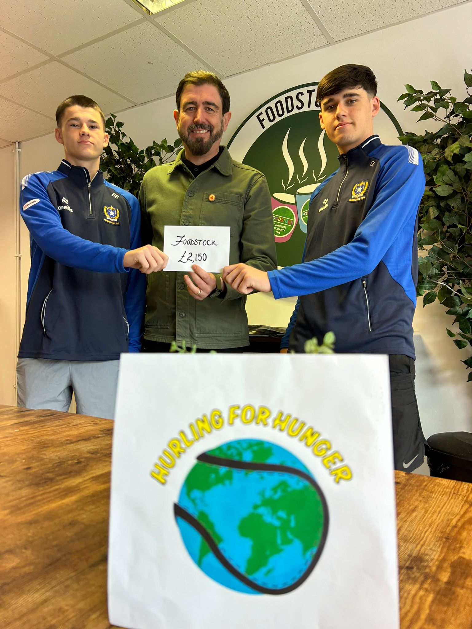 WORTHY CAUSE: Barra and Odhran Bellew presenting the cheque to Paul Doherty in Foodstock