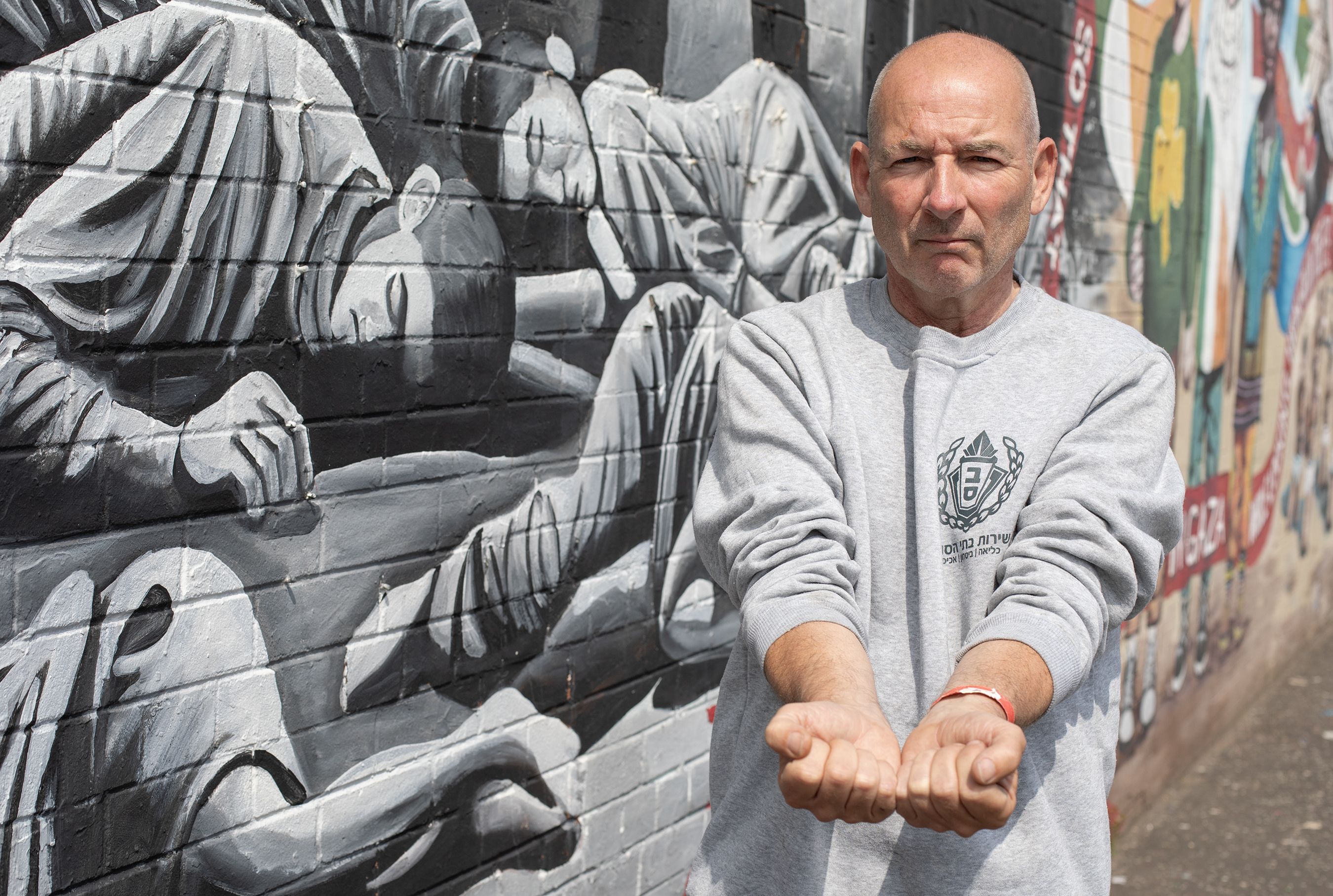 FREE: Fra Hughes at the International Wall on the Falls Road, wearing the Israeli prison uniform he was dressed in