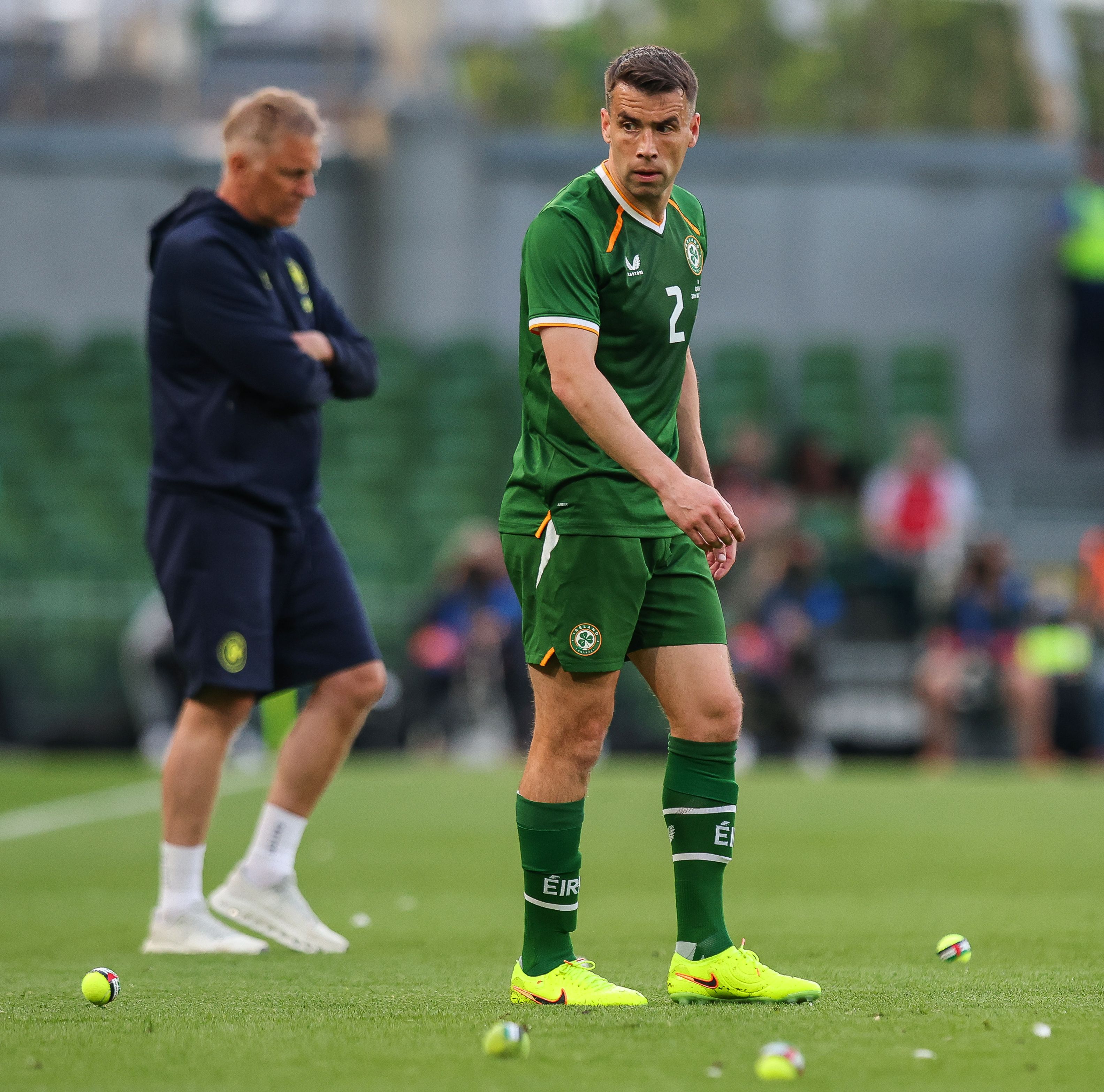 PROTEST: Captain Seamus Coleman and Heimir Halgrimmson remove tennis balls from the field of play following a protest