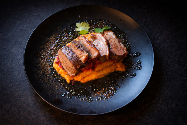 PLATING UP: Pan fried duck breast with creamy beetroot and mash