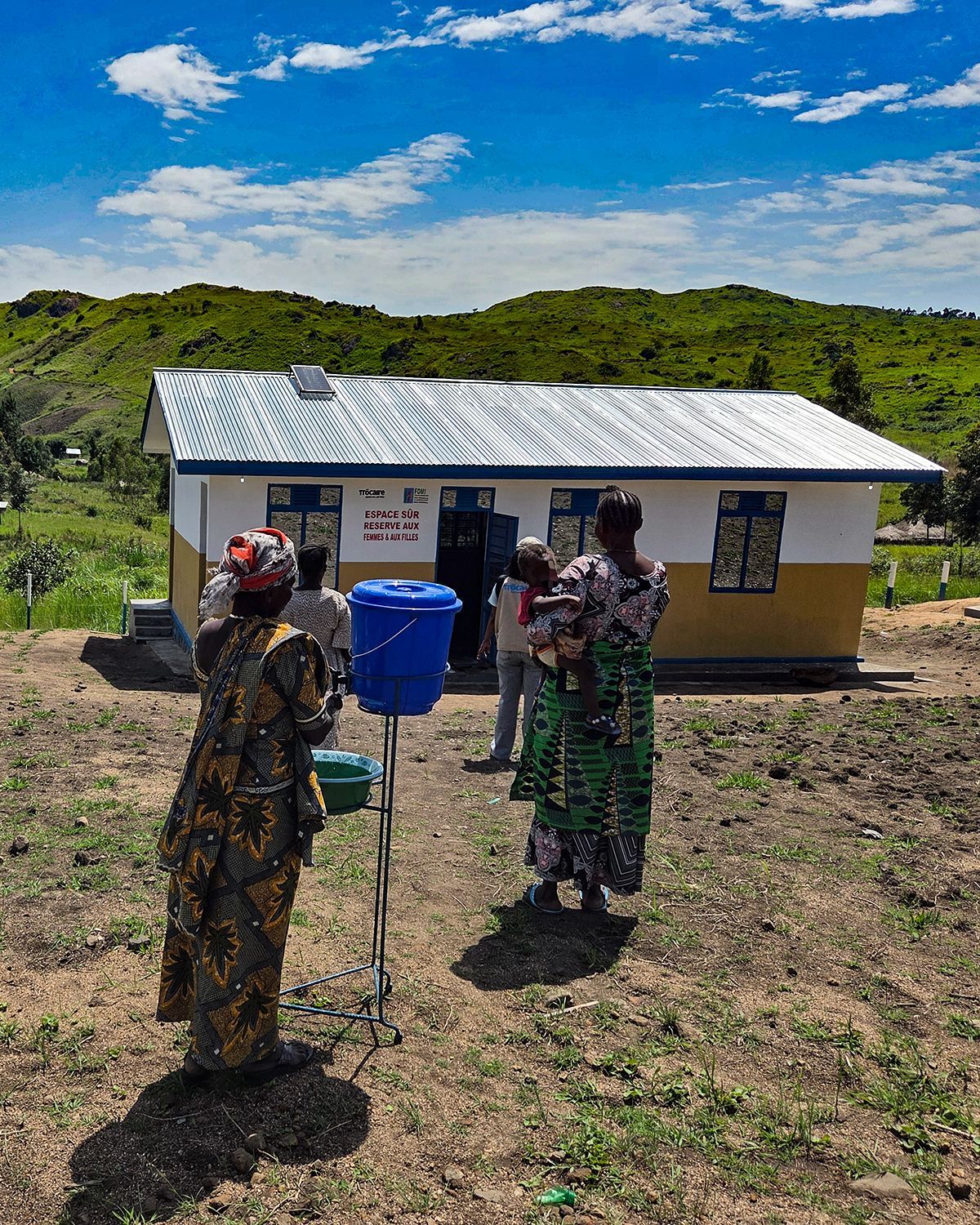 Women wash their hands before entering a ‘safe space’ built by Trócaire in DRC last week. 