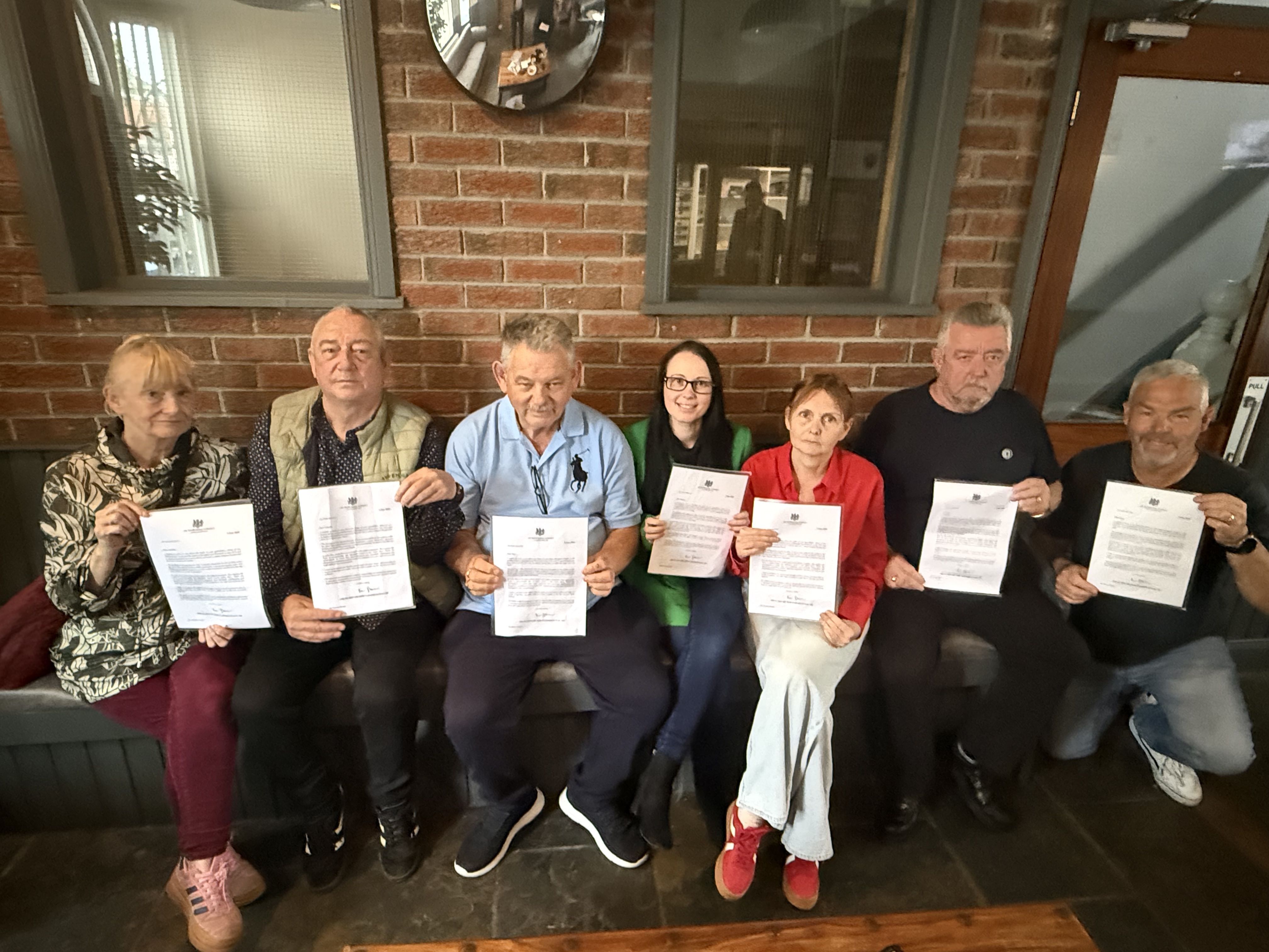 TOGETHER: The families of those who died on July 9 1972 after watching the Prime Minister\'s apology