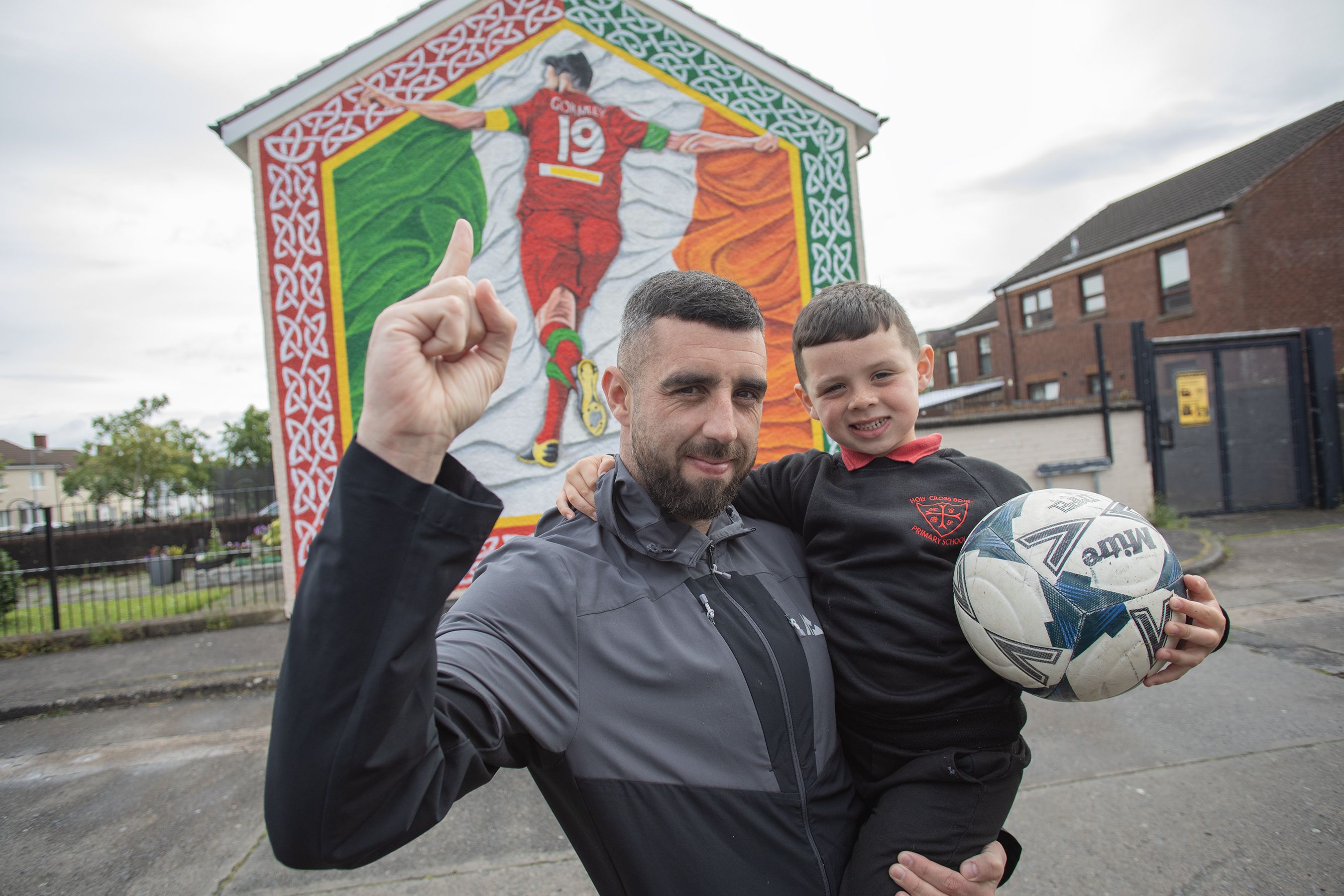 BACK OF THE NET: Joe Gormley with his son Lorcán (5) at the new mural in Ardoyne