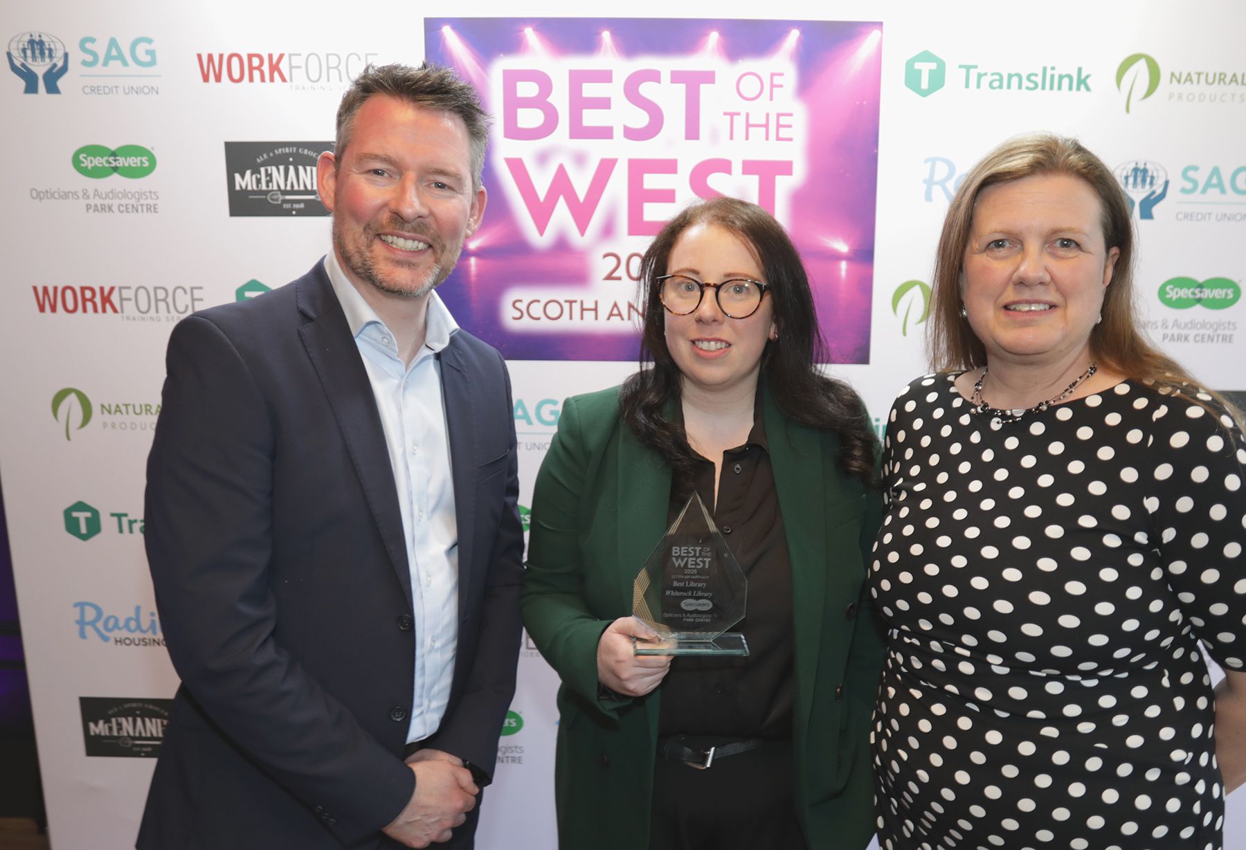 BEST LIBRARY: Tinya Parkes and Sionánn ní Nualláin from Whiterock Library with Matthew McKenny from sponsors Specsavers Park Centre