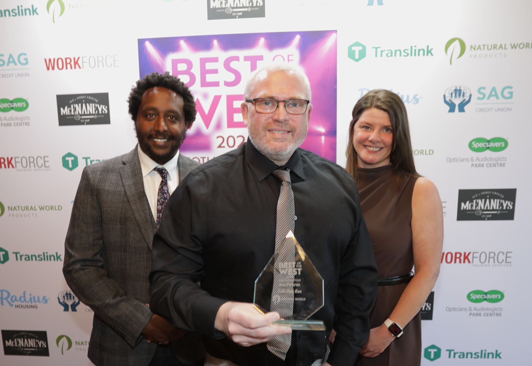 BEST PARKRUN: Gerry McDonald from Falls Parkrun with Biruk Sahle and Sharon McMaster from sponsors Natural World Products