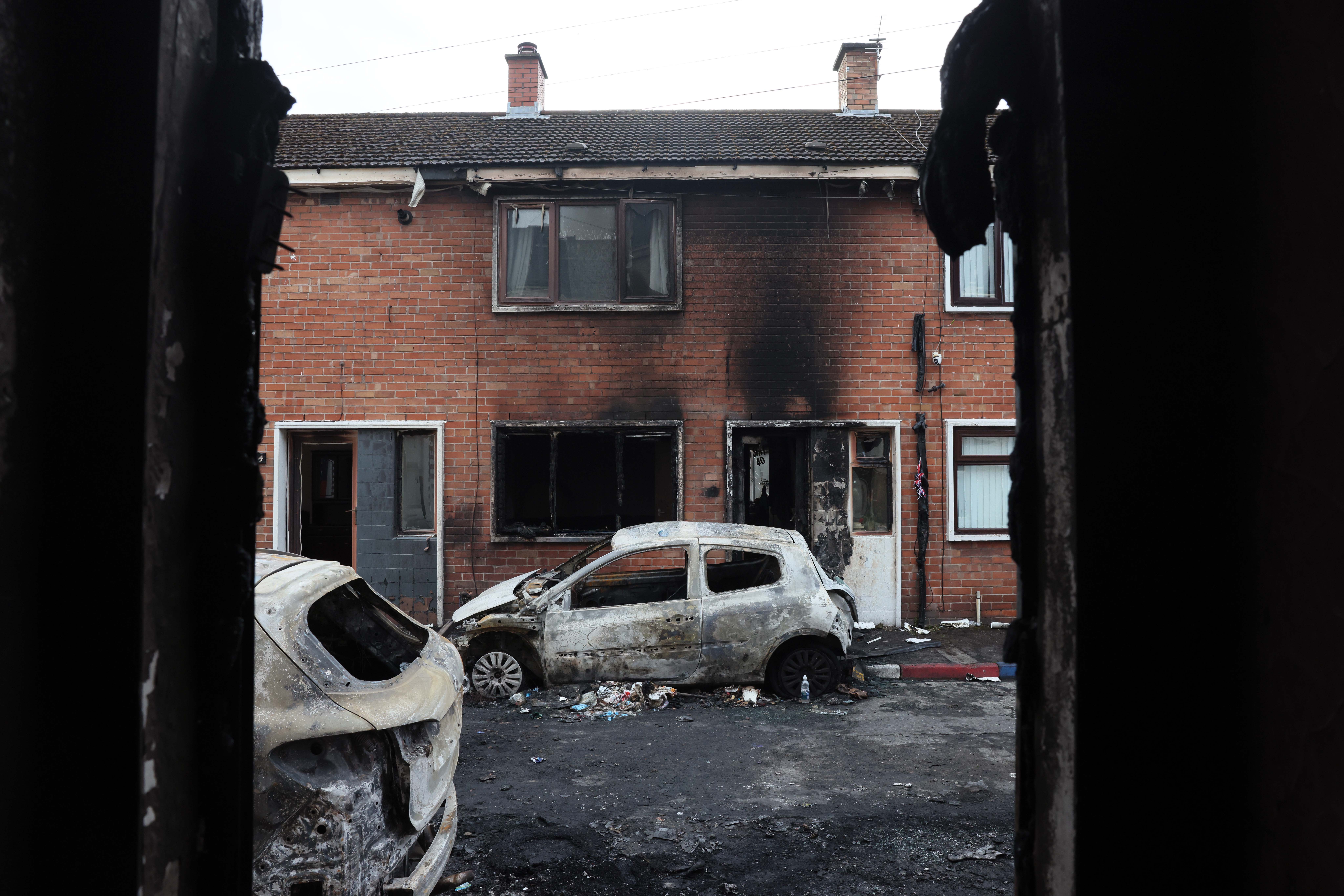 TORCHED: Cars and homes were attacked by a far-right mob in Lendrick Street in East Belfast on Tuesday evening