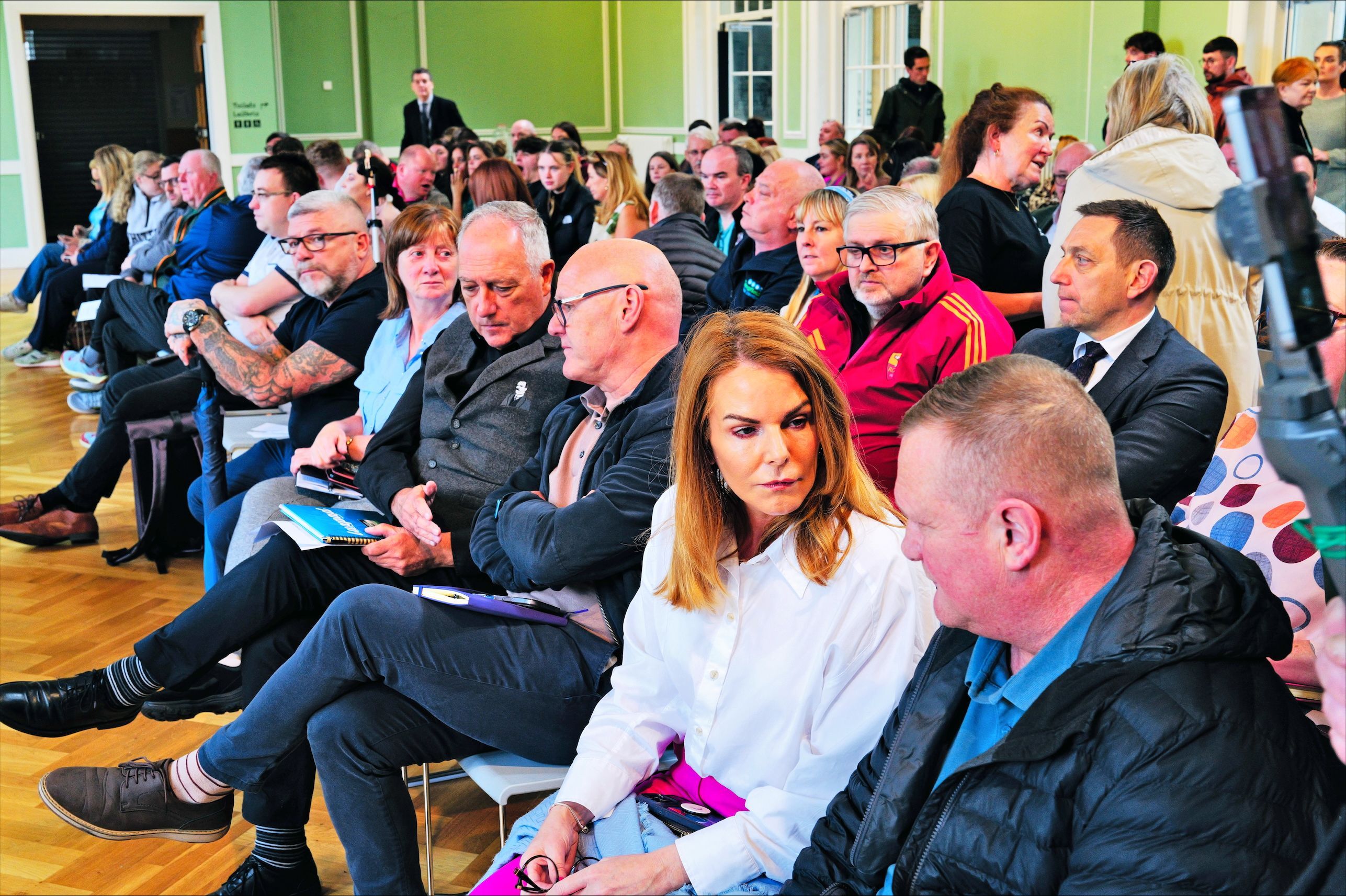 \"SPIRIT OF ACCEPTANCE\": Community and political leaders at an emergency meeting in St Comgall\'s centre in West Belfast in response to upsurge in racist attacks on immigrants and people of colour