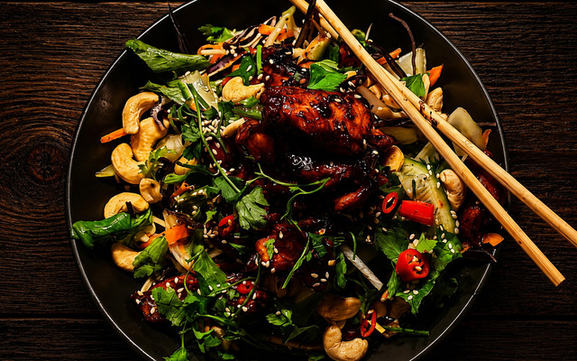 PLATING UP: Char siu chicken thigh chunks with Asian salad