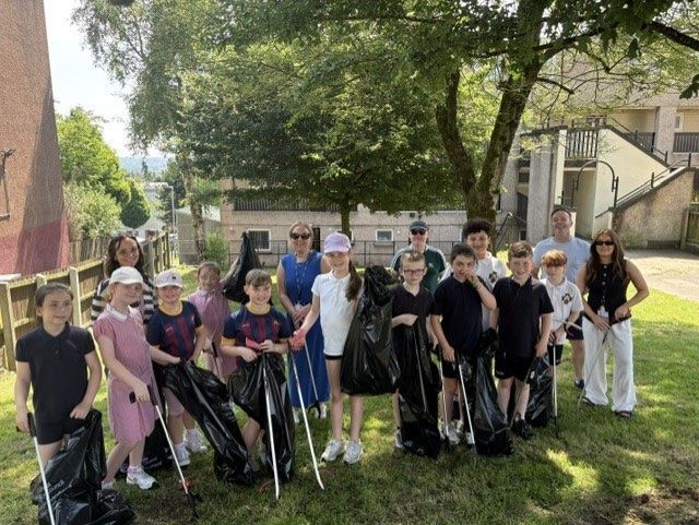 COMMUNITY CLEAN-UP: Pupils from St Oliver Plunkett PS and mentors put in a hard day\'s work