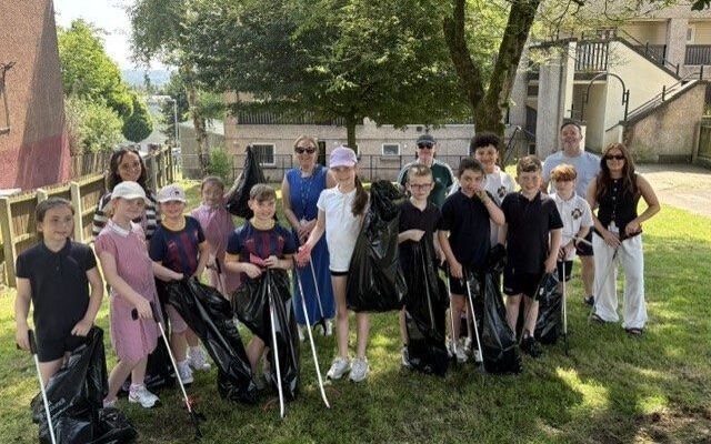 St Oliver Plunkett PS pupils take part in successful community clean-up in Lenadoon
