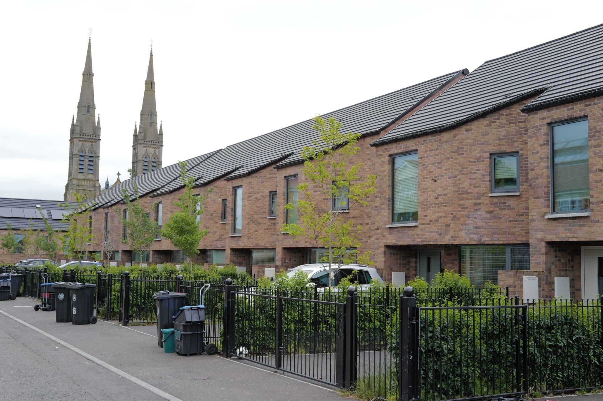 EMPATHETIC HOUSING: Ross Street Mews off the Falls Road , designed by Studio Rogers\' architects, replaced vandal-plagued flats