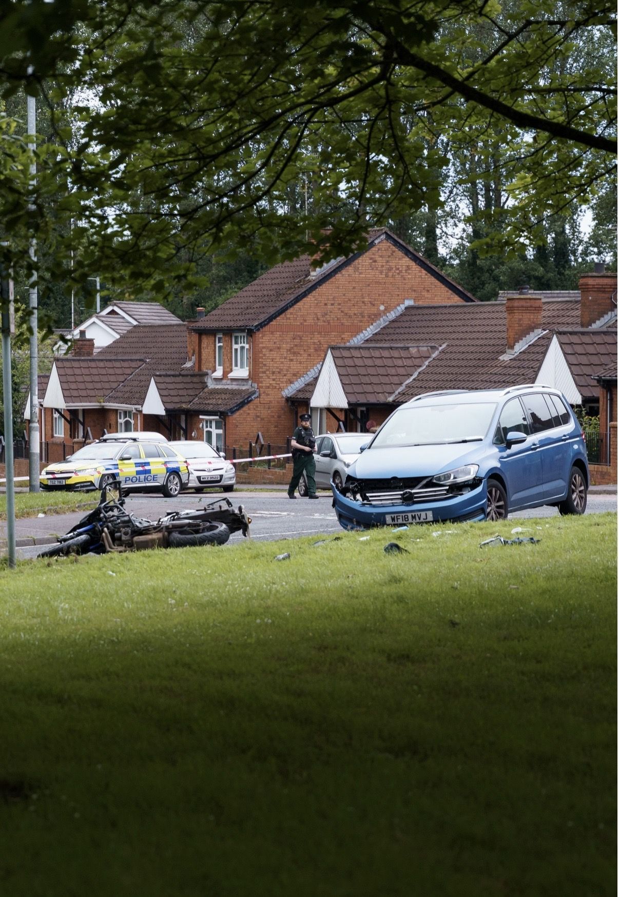 SCENE: The motorbike and car on the Shaws Road