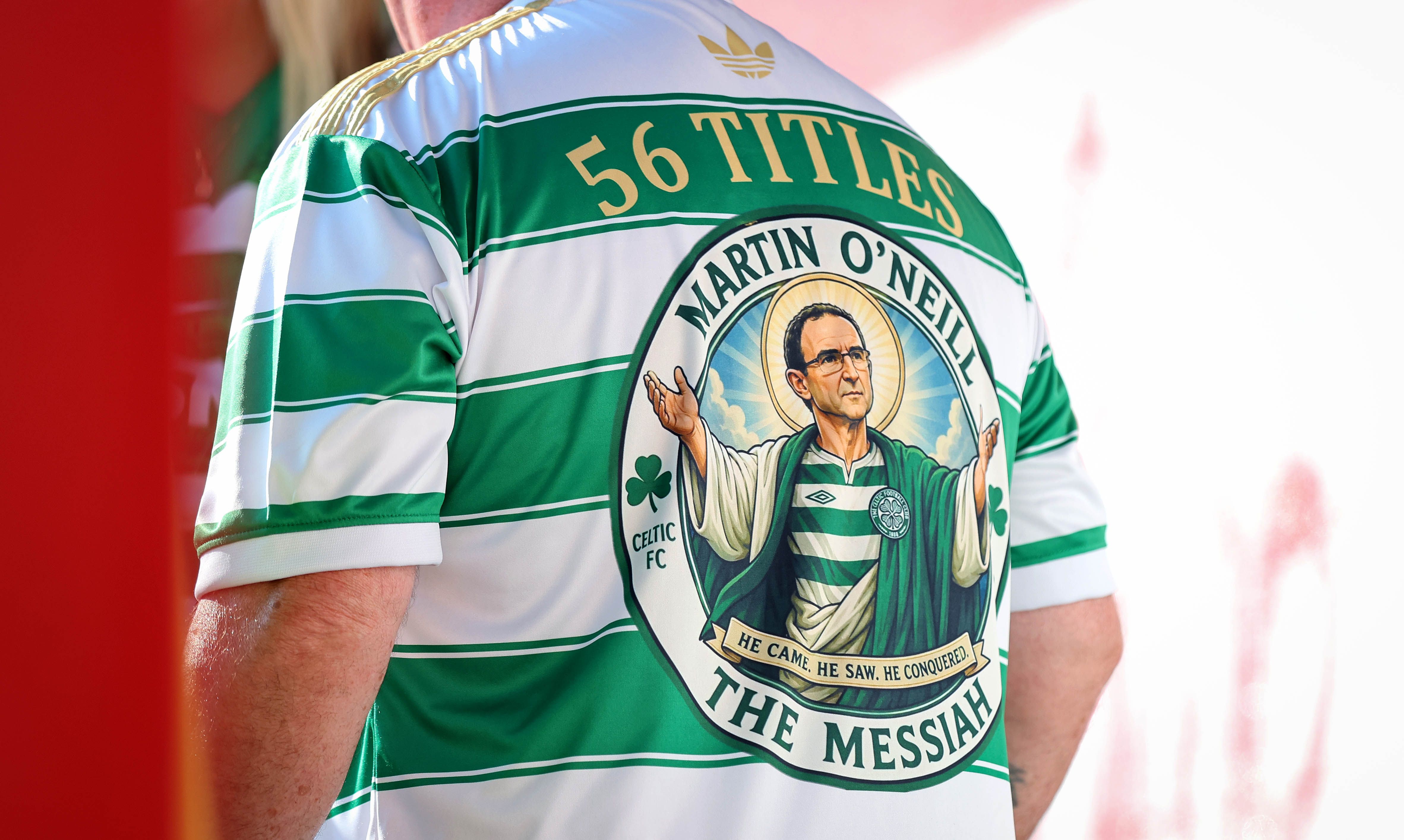 A Celtic fan in the crowd boasting his newest Martin O\'Neill themed jersey