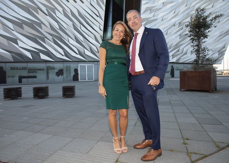 RED CARPET IN BELFAST: Major Craig Costello of the New Jersey State Troopers, pictured with his wife Rihanna, was a recipient of the Belfast Ambassador Medal at the 2025 Homecoming. The couple are pictured in front of fhe city\'s striking Titanic Mueum.