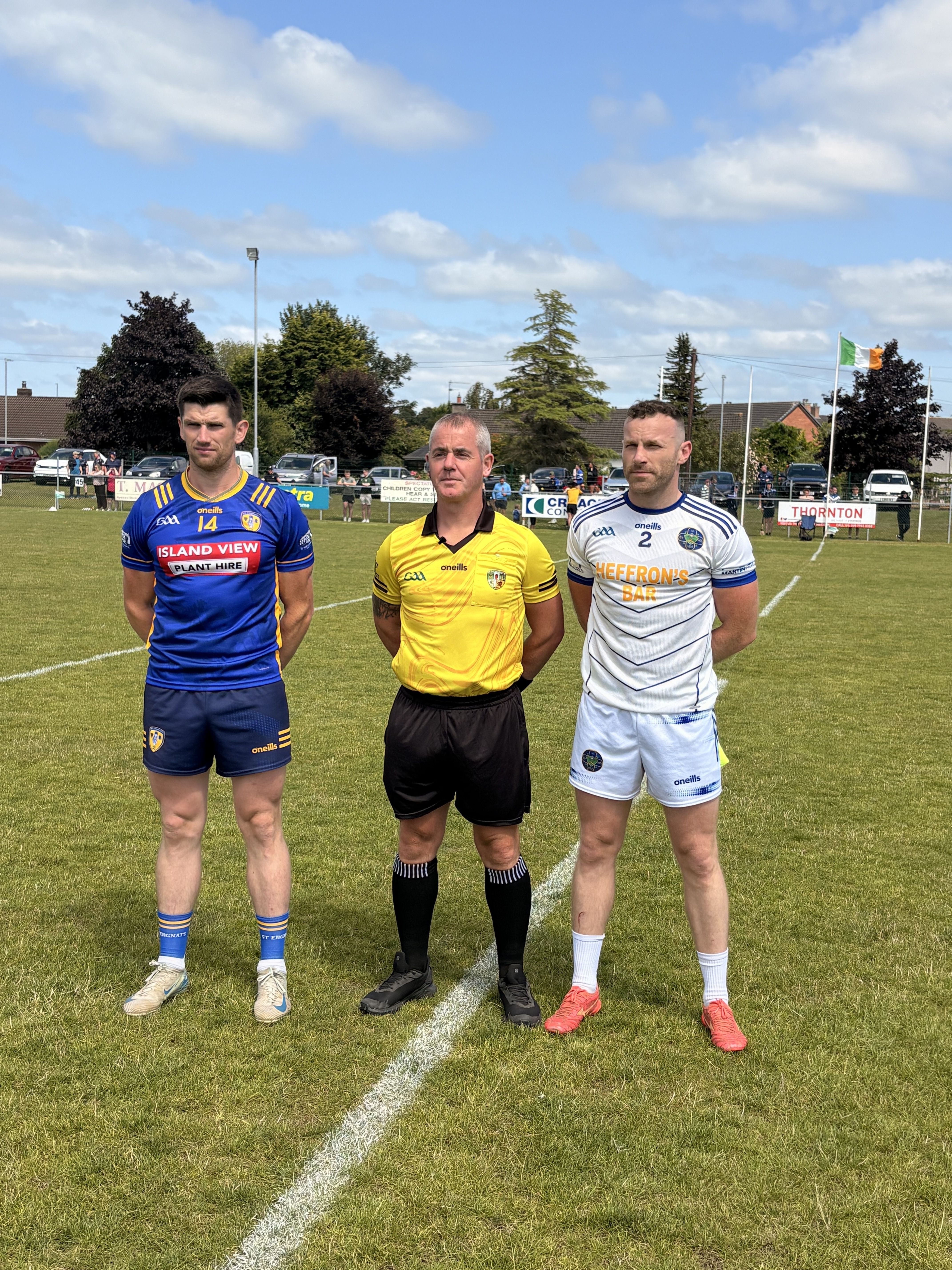 CLASH: Colum Duffin (Moneyglass) and Ciaran McGrellis (Tir na nÓg) either side of Colm McDonald for the big clash in Toome