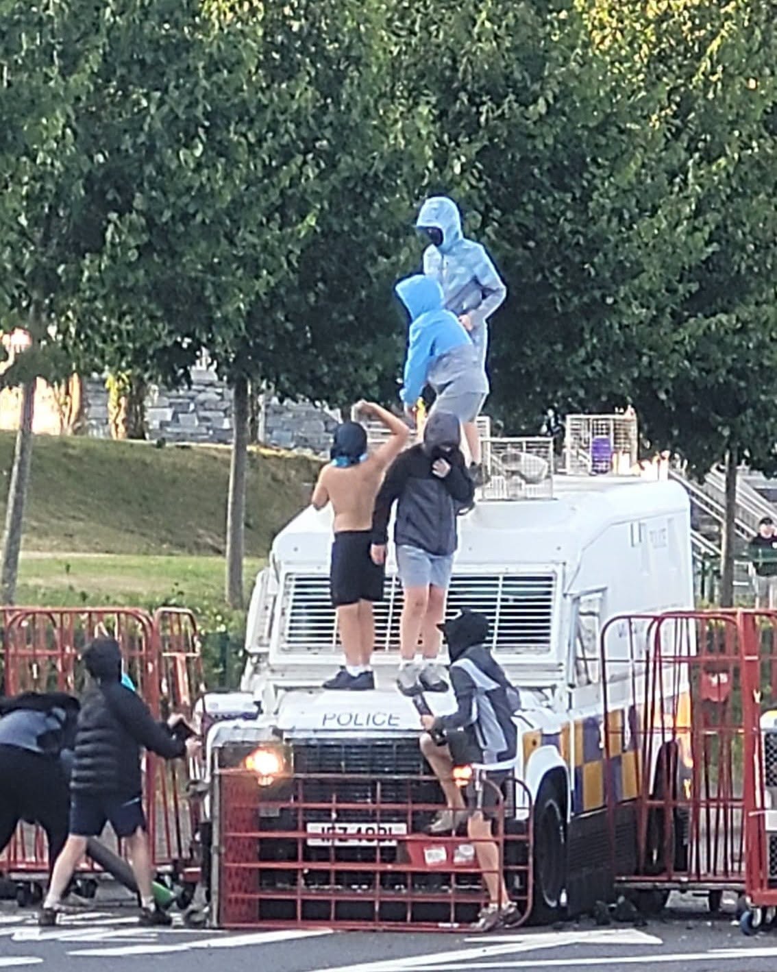 CHAOS: Youths surrounding an RUC Land Rover on the Stewartstown Road on Saturday night