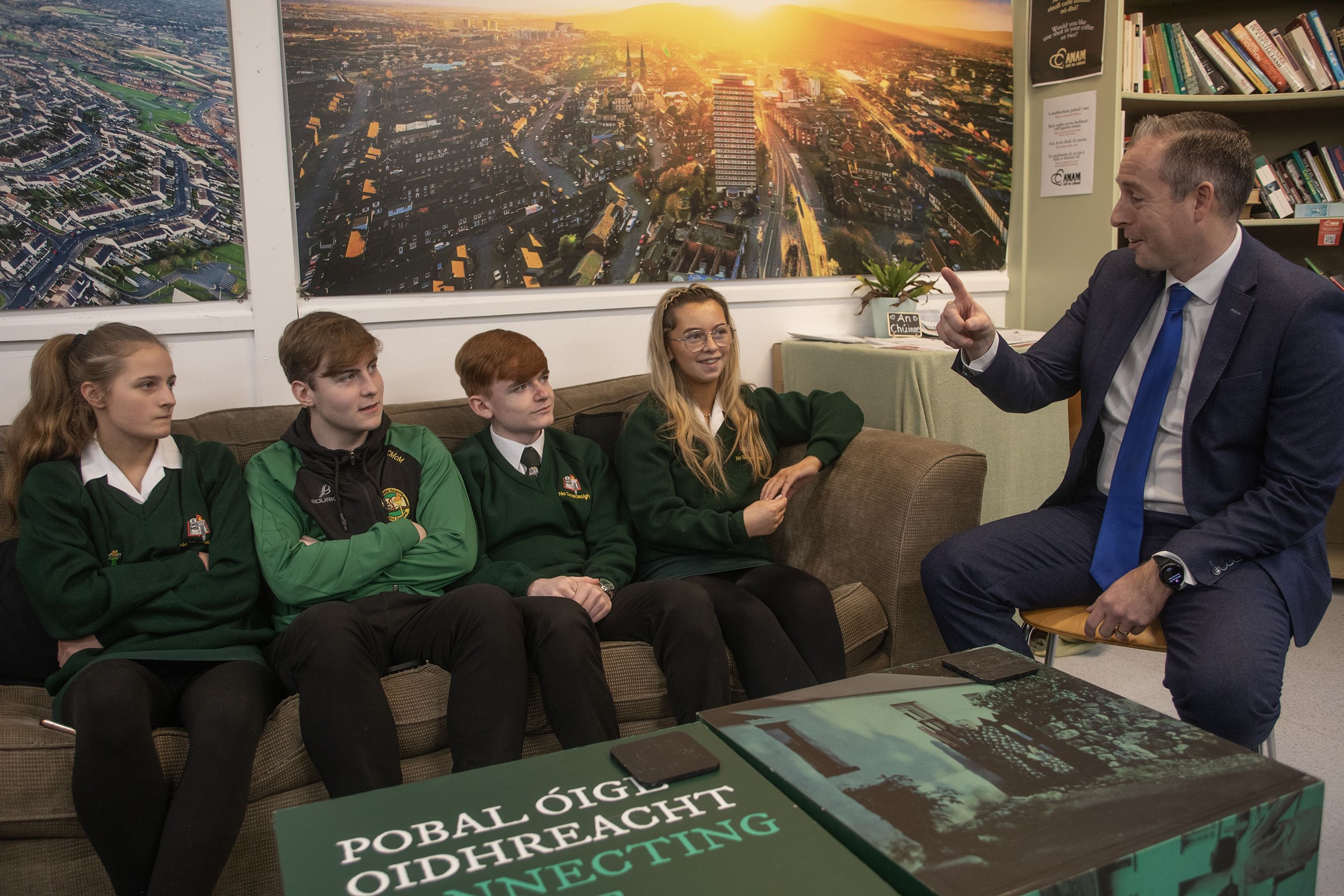 EARLY PROMISE: Minister Paul Givan visiting the Anam caifé of Irish language group Glór na Móna last year