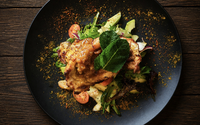 PLATING UP:  Grilled pork chop with salad and apple chutney