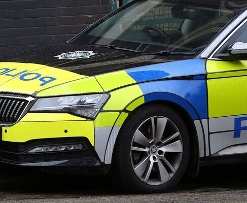 Man arrested after car hits police officer on Whiterock Road 