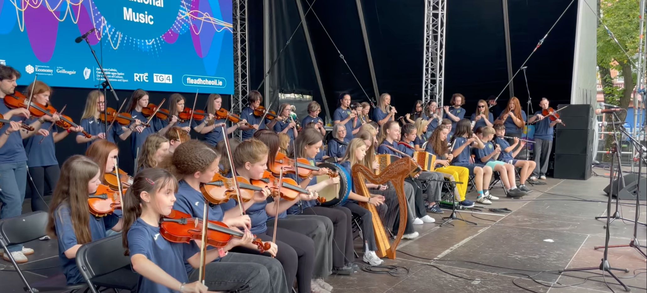 GIG RIG: Pupils from Glengormley School of Traditional Music performing at the City Hall stage during the Fleadh