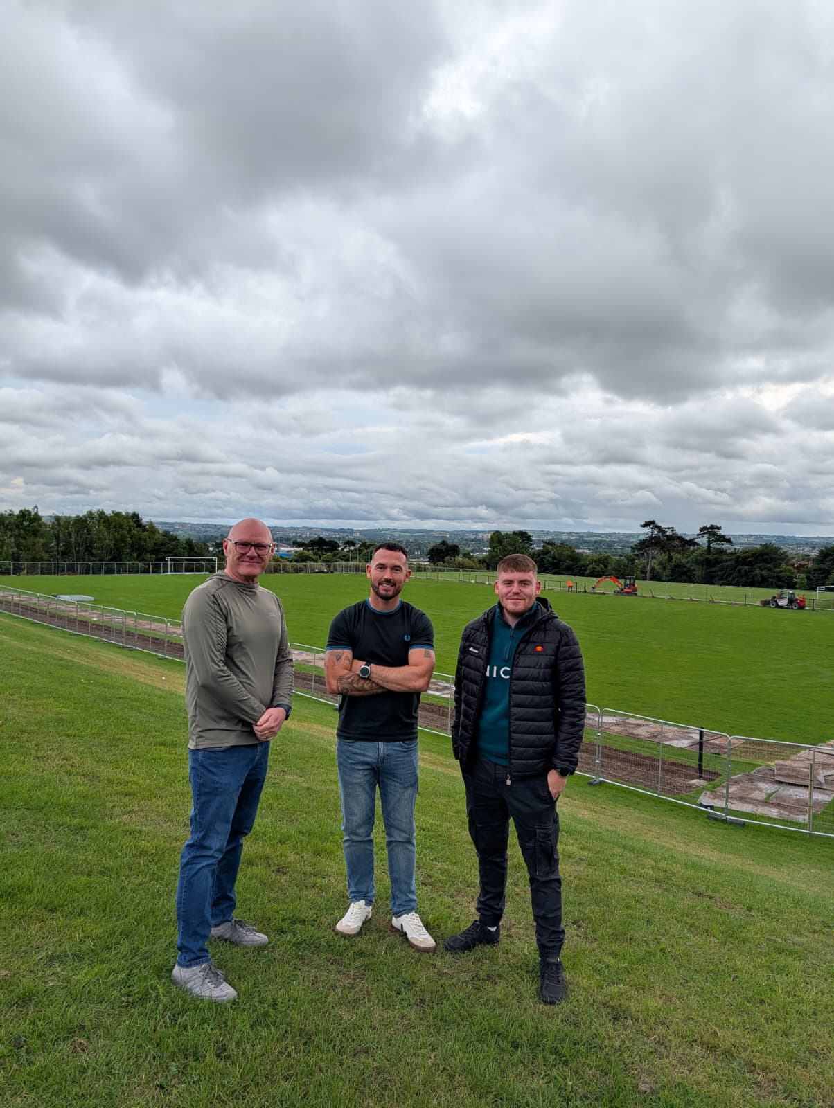 WELCOME: West Belfast MP Paul Maskey, Councillor Michael Donnelly and Councillor Ronan McLaughlin view the work that is going on