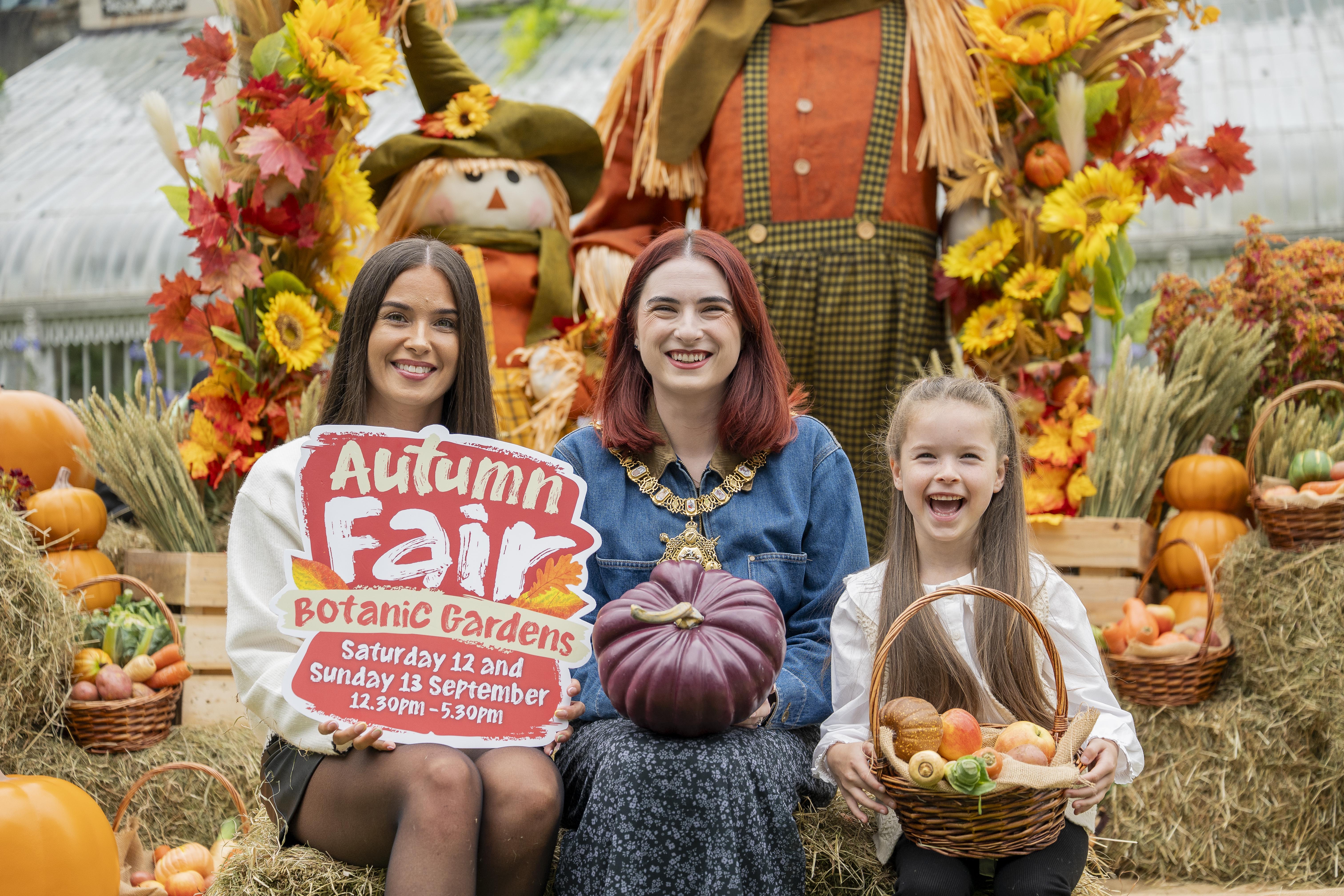 CHANGING OF THE SEASONS: Lord Mayor of Belfast, Róis-Máire Donnelly with Melissa Strain and Posie Horner (6) as they look forward to the annual Autumn Fair at Botanic Gardens in South Belfast on 12 and 13 September