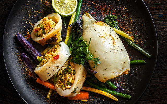PLATING UP: Stuffed calamari tubes with curried orzo rice