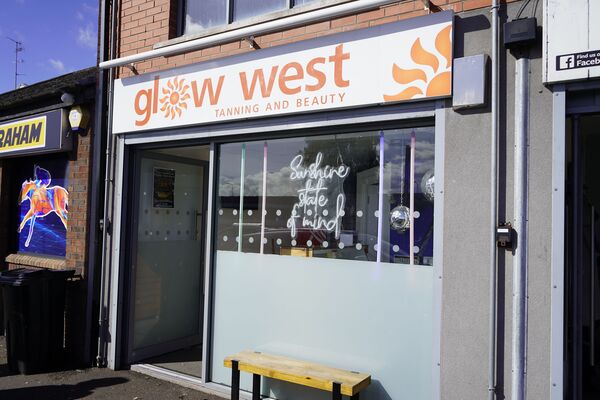 Male attacked with hammer during attempted robbery of West Belfast tanning salon