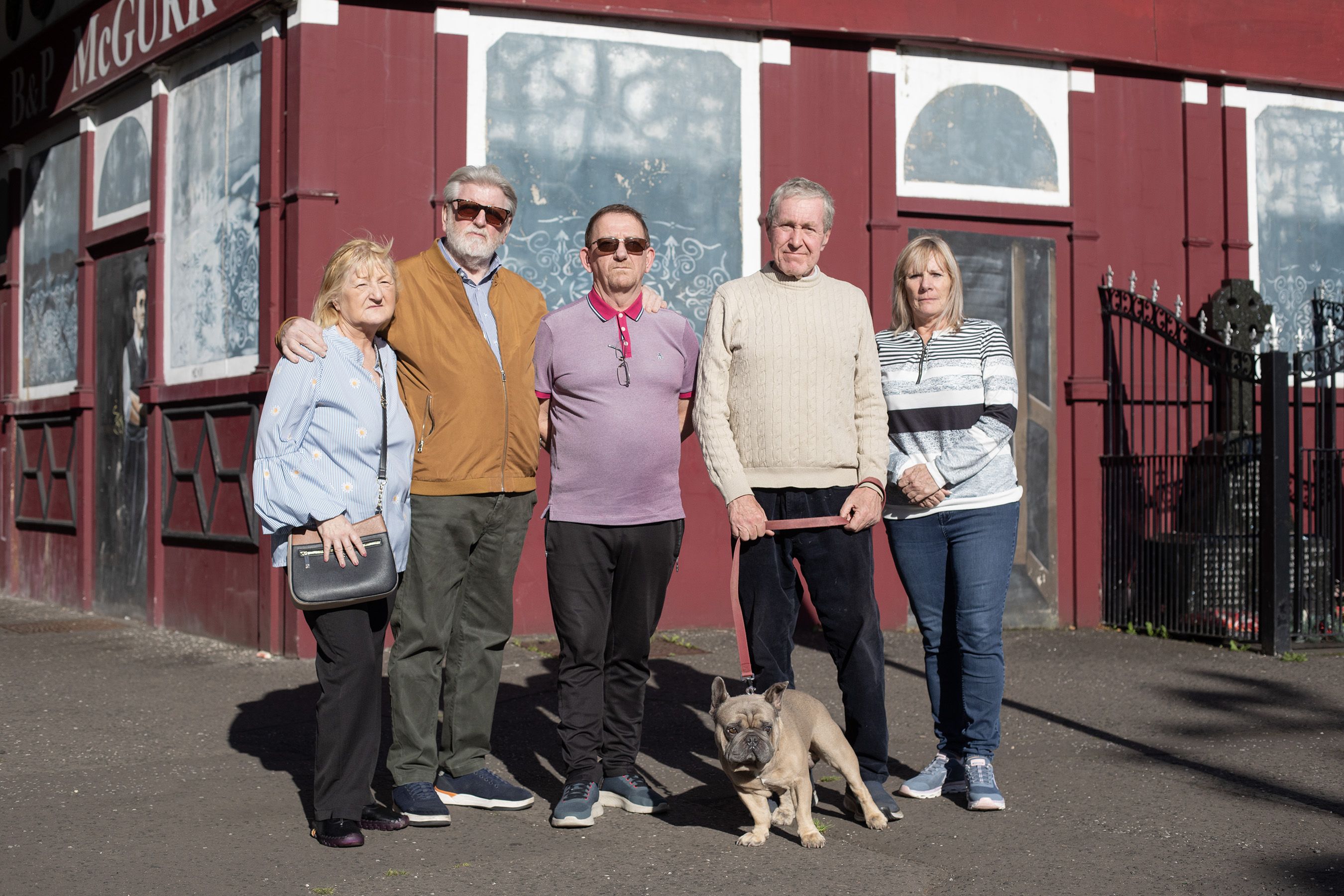 FRUSTRATED: Playwright Martin Lynch, second left, with Eileen O\'Halloran from Green Shoot Productions, at the spot where McGurk\'s bar stood, with community workers Paddy McCooey and Joe Doherty and Mary Kane, whose father Eddie died in the massacre 