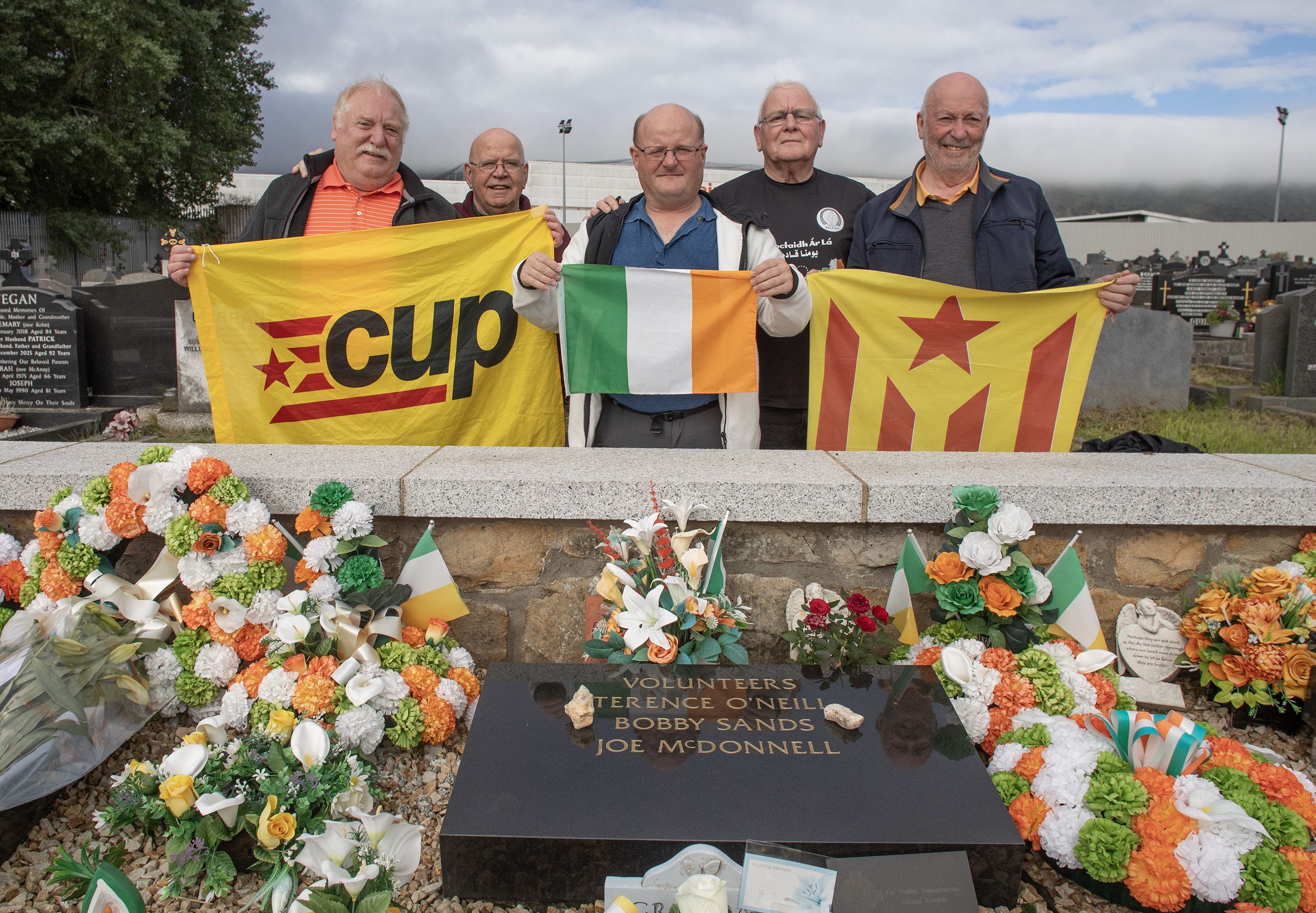 RESPECTS: After their return to the Republican Plot at Milltown Cemetery