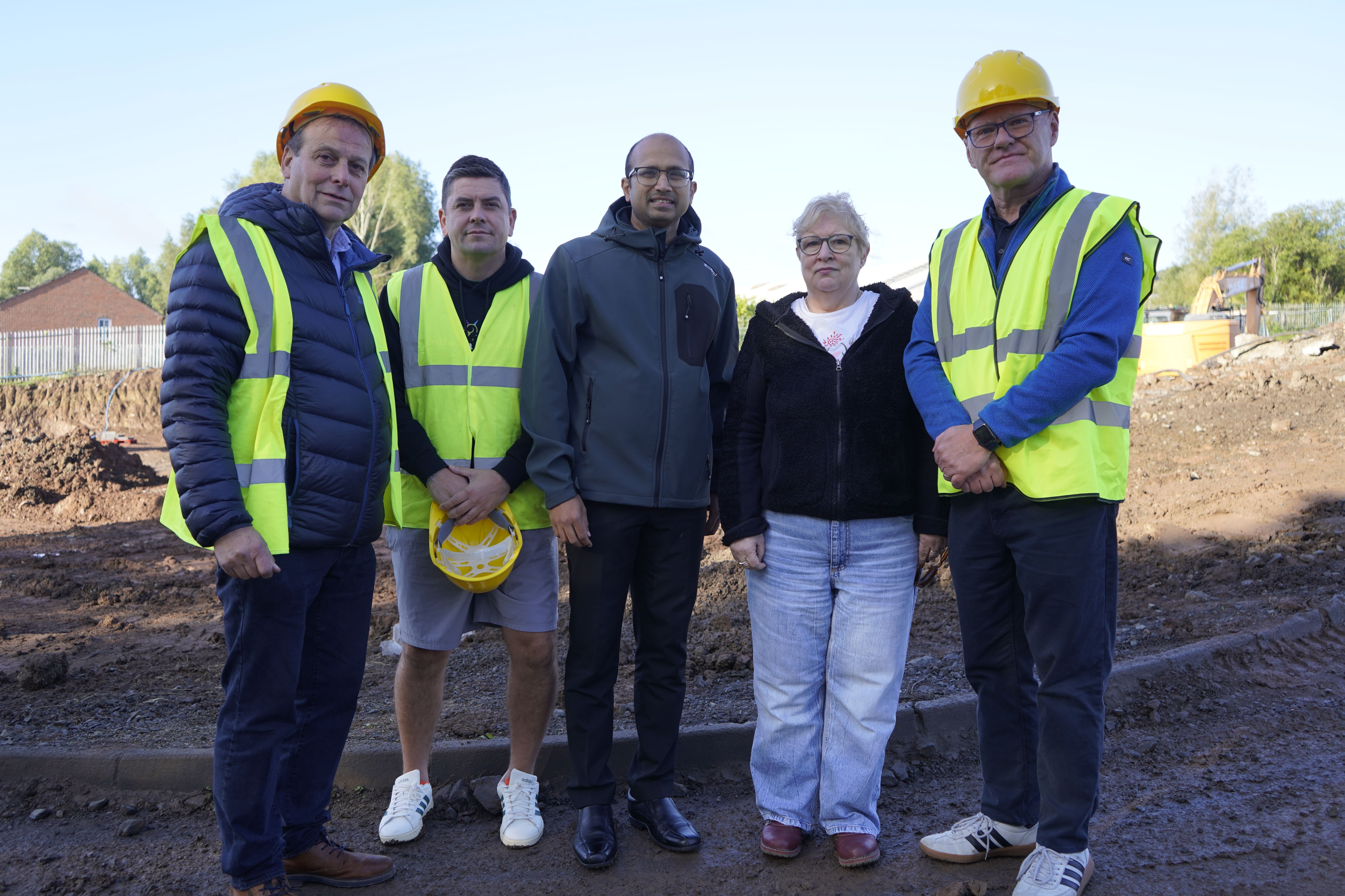 CONDEMNATION: Basil O\'Malley (Newpark Homes), Danny Baker MLA, Fr Nideesh Varghese, Teresa Cowan (Parish Secretary) and West Belfast MP Paul Maskey