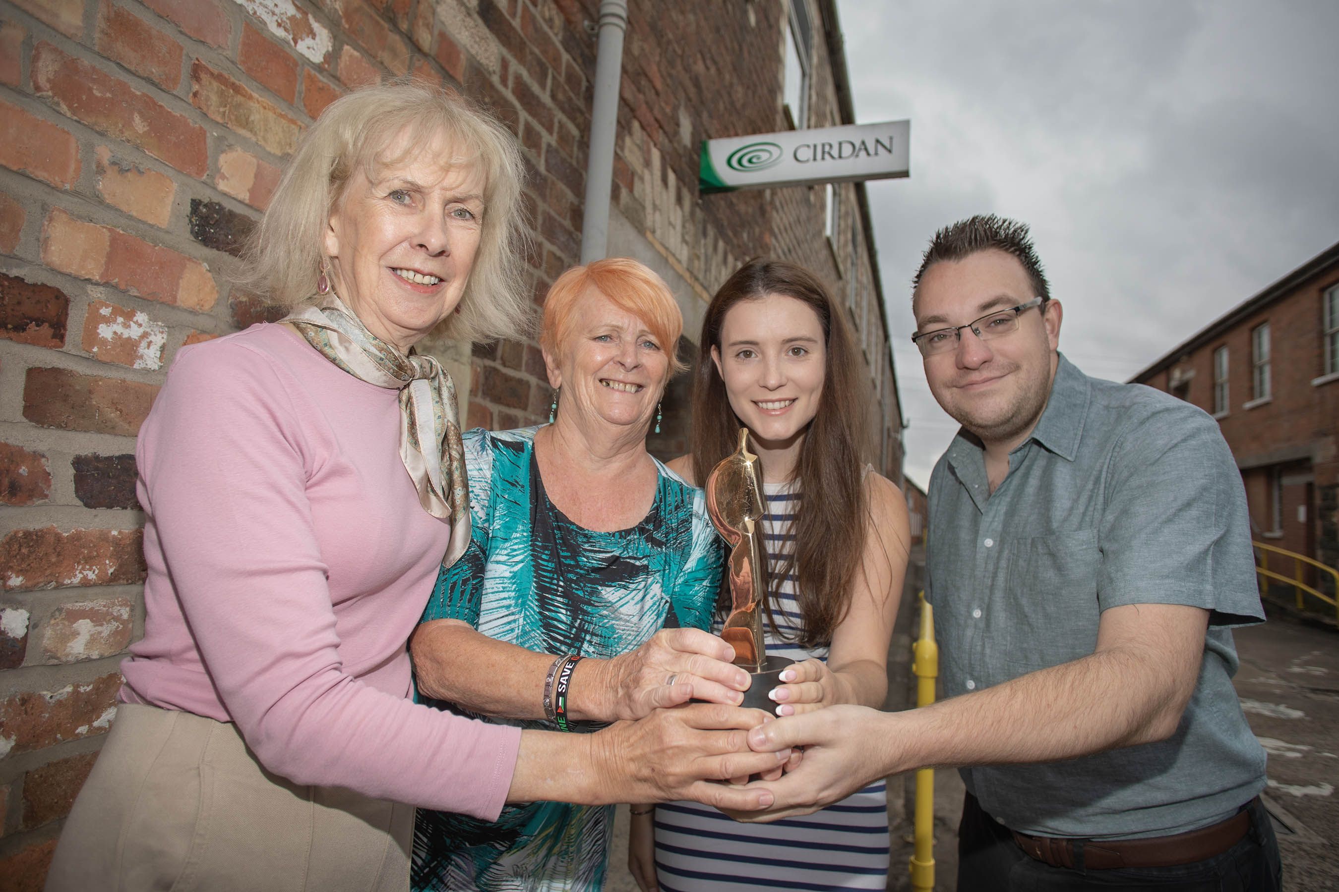 EVERYONE\'S A WINNER: Mary Shannon and Carol Jackson from last year\'s winners Féile Women\'s Choir, Rebecca Fitton from sponsors Cirdan and Conor McParland from Belfast Media