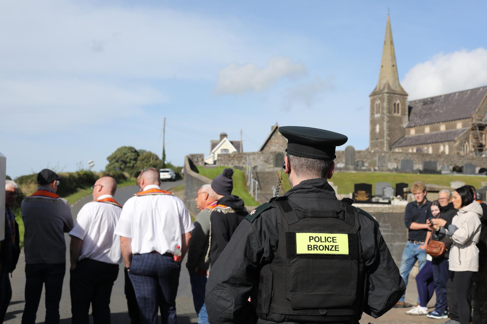 NO GO: A small group of Orangemen move back up Drumcree hill after being prevented from marching on to the Garvaghy Road this morning