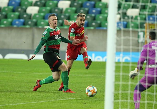 Conor McMenamin gets his shot away despite Ciaran O'Connor closing in