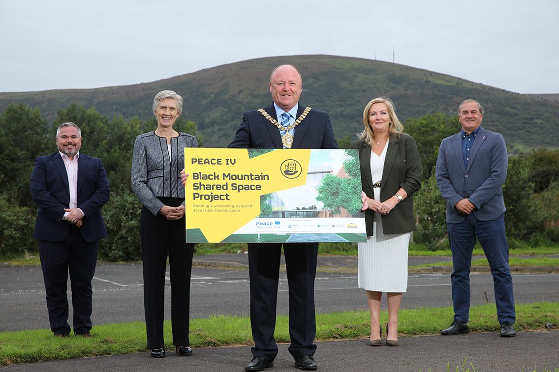 TOGETHER: Gerard Murray (Director of Regional Development at the Department for Communities), Finola Moylette (Ireland’s Department of Rural and Community Development), Lord Mayor Frank McCoubrey, Gina McIntyre (CEO of the Special EU Programmes Body (SEUPB), and Paul Millar (Chairman of Black Mountain Shared Space) at the former Finlay’s factory site