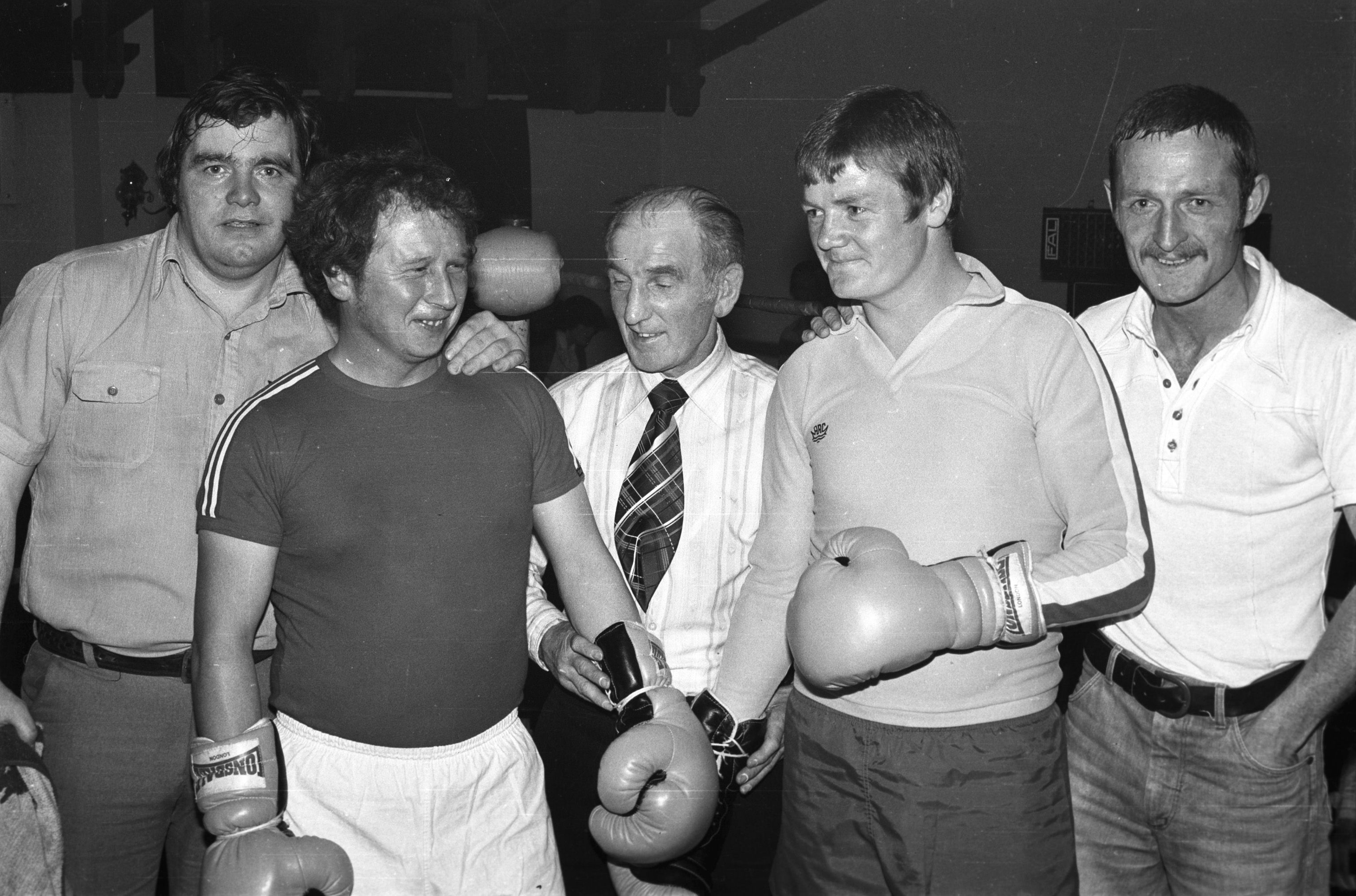 Referee ‘Bunty’ Doran instructs Sammy Hyland and Bobby Campbell with Jim Burns and Dingus Magee looking on. Veteran boxers compete at Martin Forsythe Club