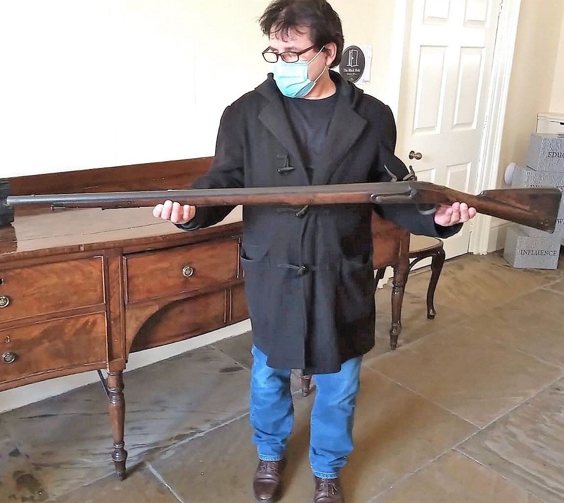 Brendan Muldoon (author) holding Night Watchman's Musket used to ward of Body Snatchers, 1830.  With kind permission of Archive & Heritage Coordinator, Clifton House Heritage Centre