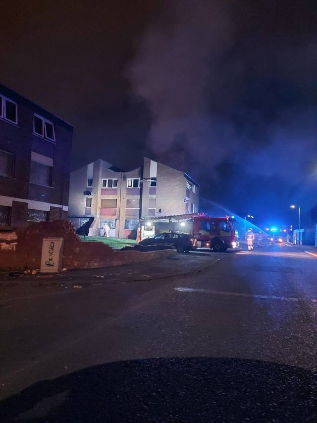 The Fire Service tackle a blaze a Ross Street flats on Sunday