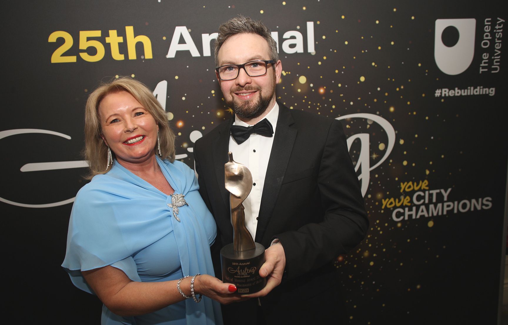 MEDICINE MEN (AND WOMEN): Pat Cullen, President of Royal College of Nursing, presents the TG4 Aisling Roll of Honour Award to Community Pharmacists NI Chair Peter Rice.