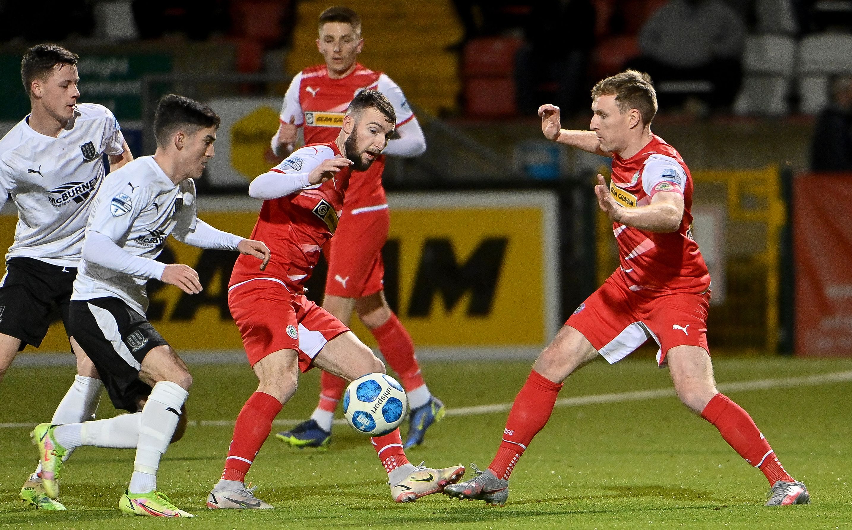 Jamie McDonagh is challenged by Brendan Barr