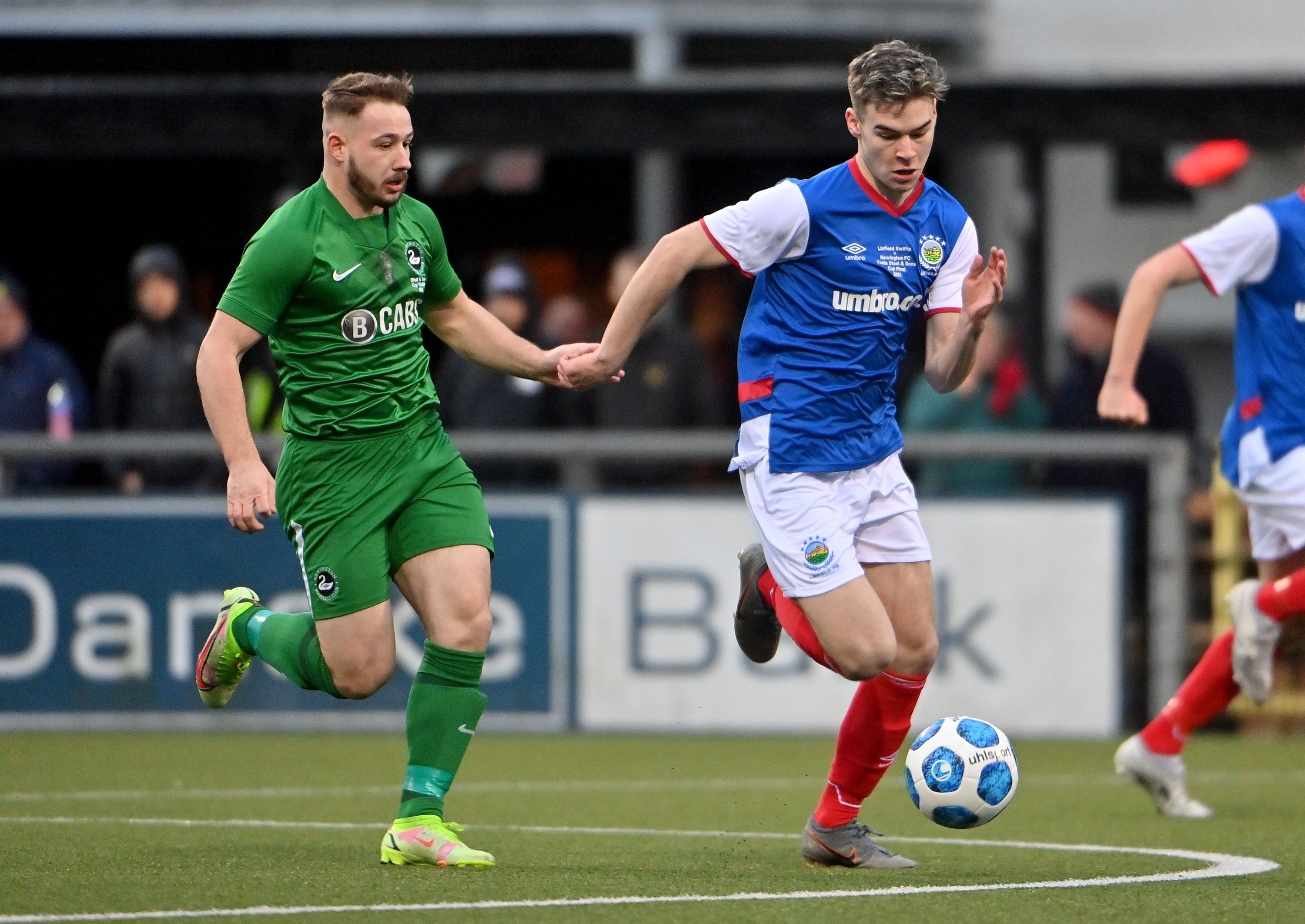 Man-of-the-Match Robbie McVarnock gives chase to Linfield's Adam Carroll 