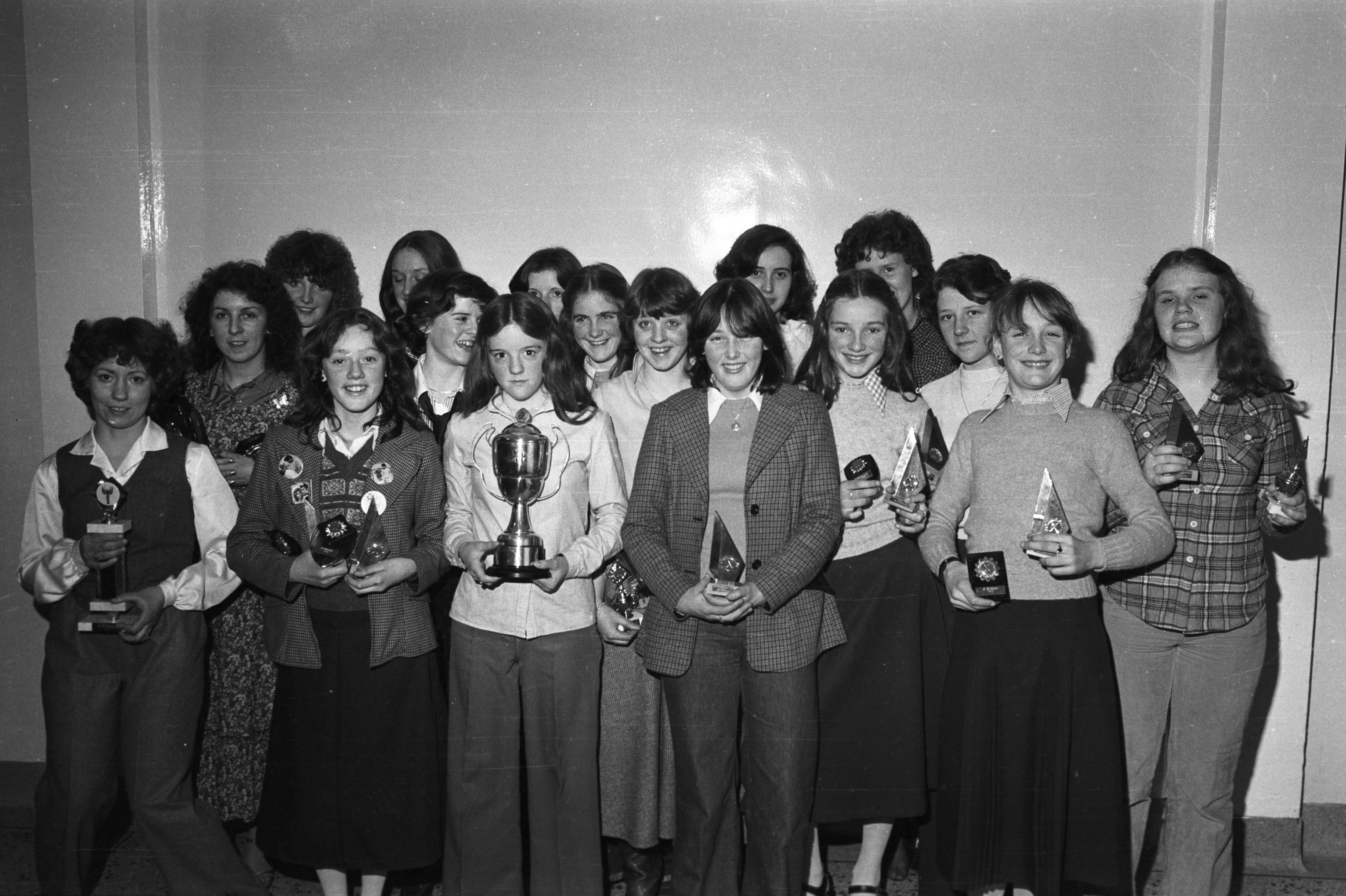 Ardoyne Óg winners of South Antrim Minor Camogie League and Antrim Minor seven-a-side, show off their trophies at the Ardoyne (Ard Eoin) Óg Ceilí in St Gabriel's School