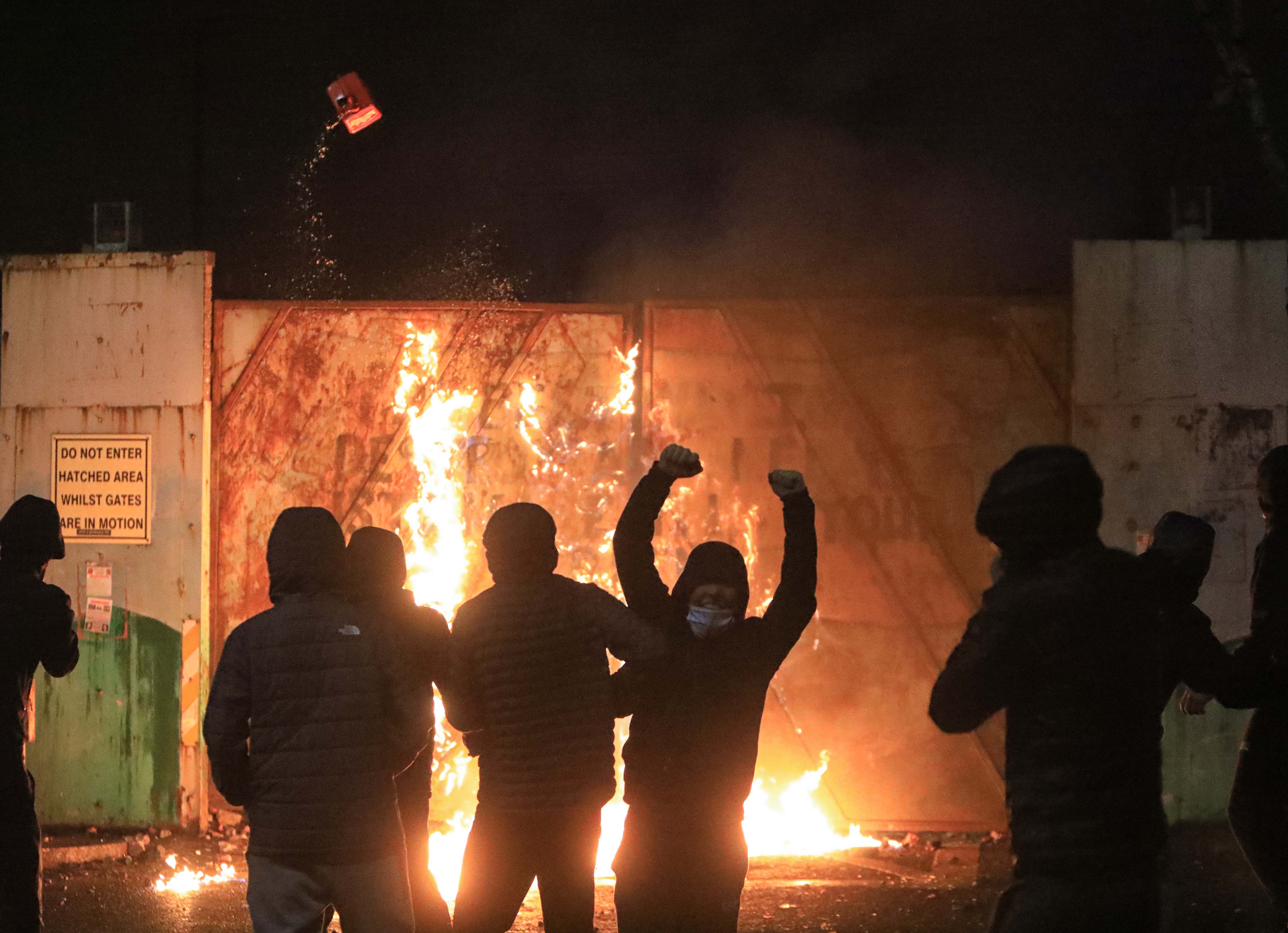 HEADLINE GRABBERS: Rioters at Lanark peace wall on 7 April.