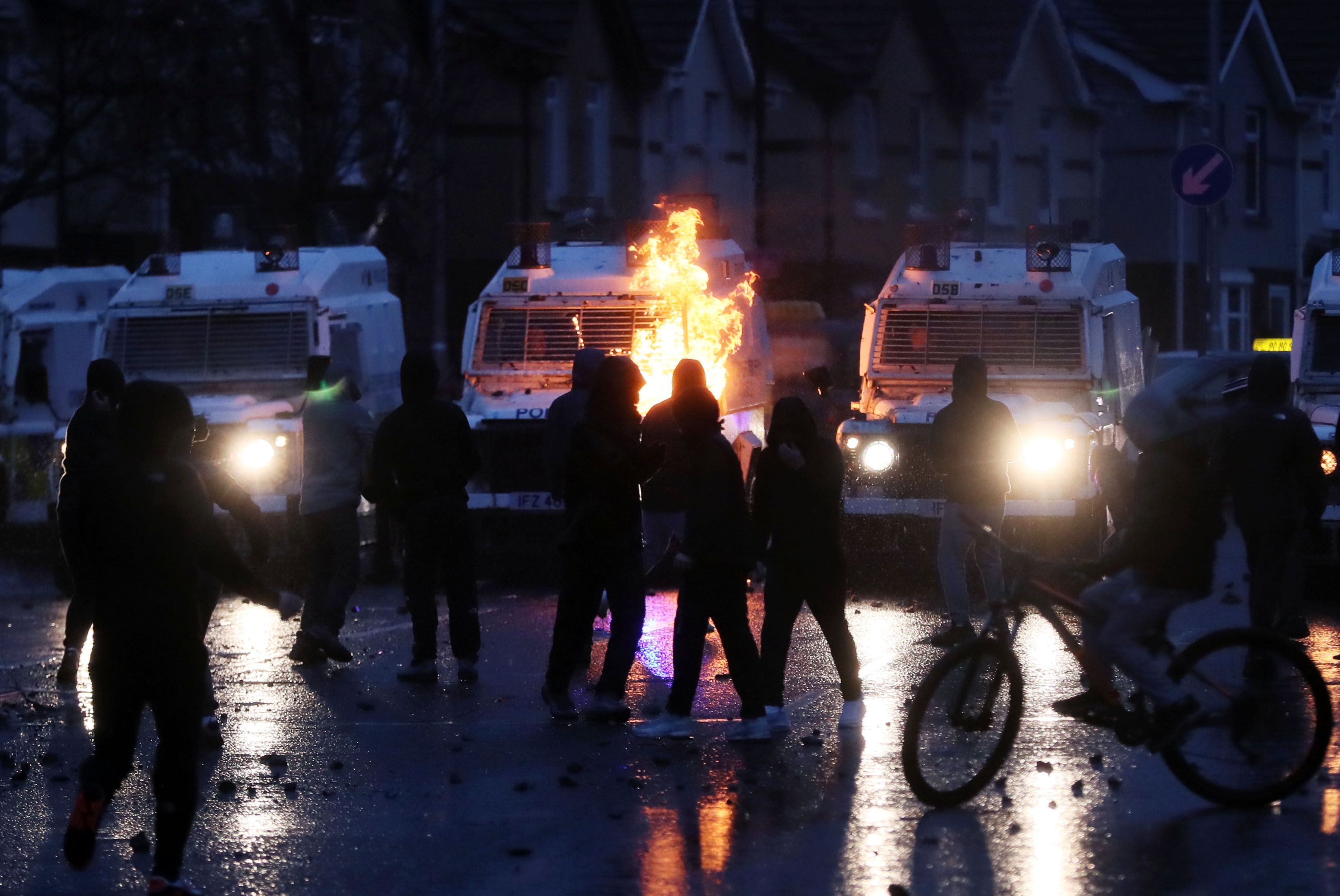 PETROL BOMB: A petrol bomb is thrown at police during the violence