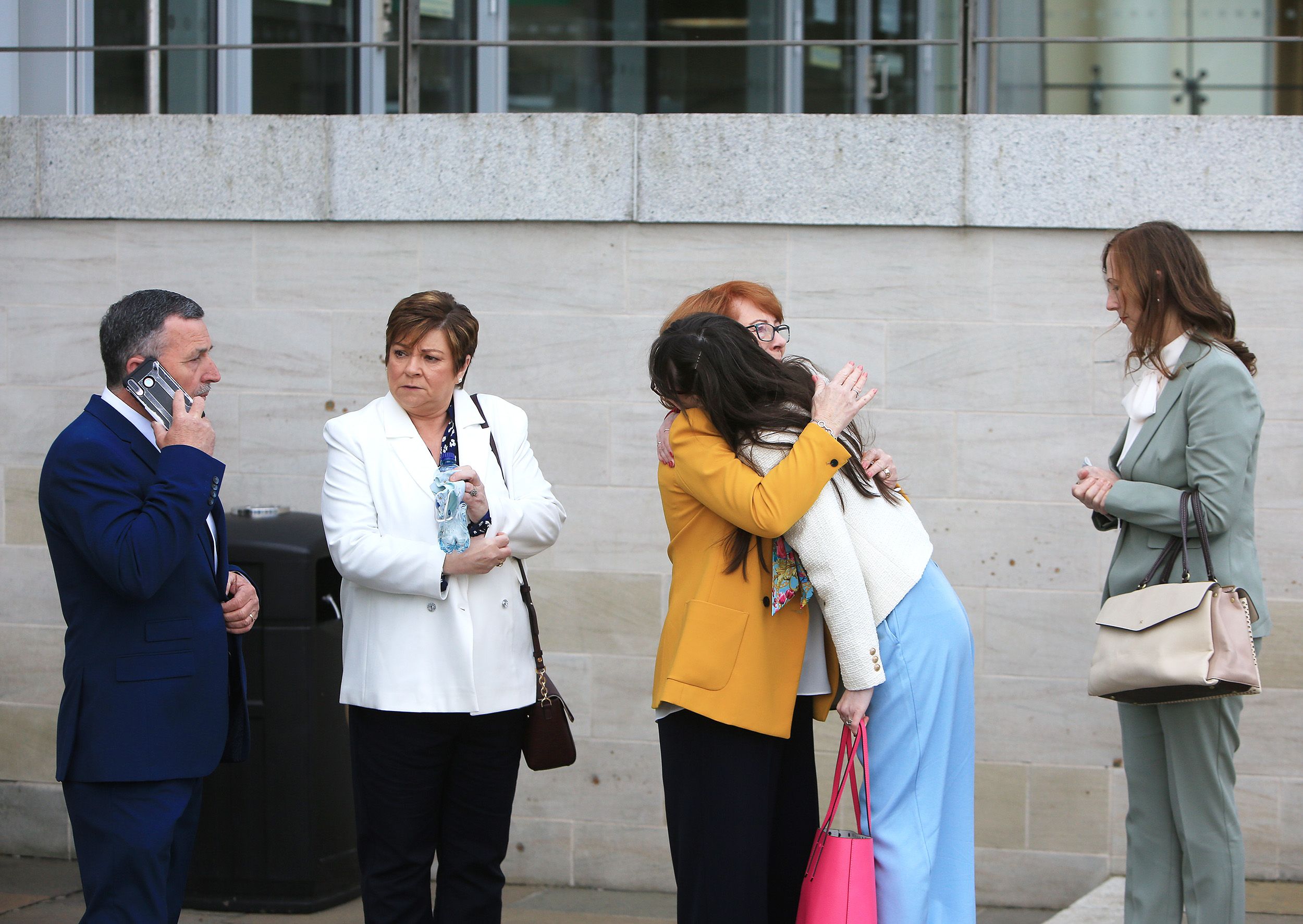 TOGETHER: Families greet each other before today's ruling